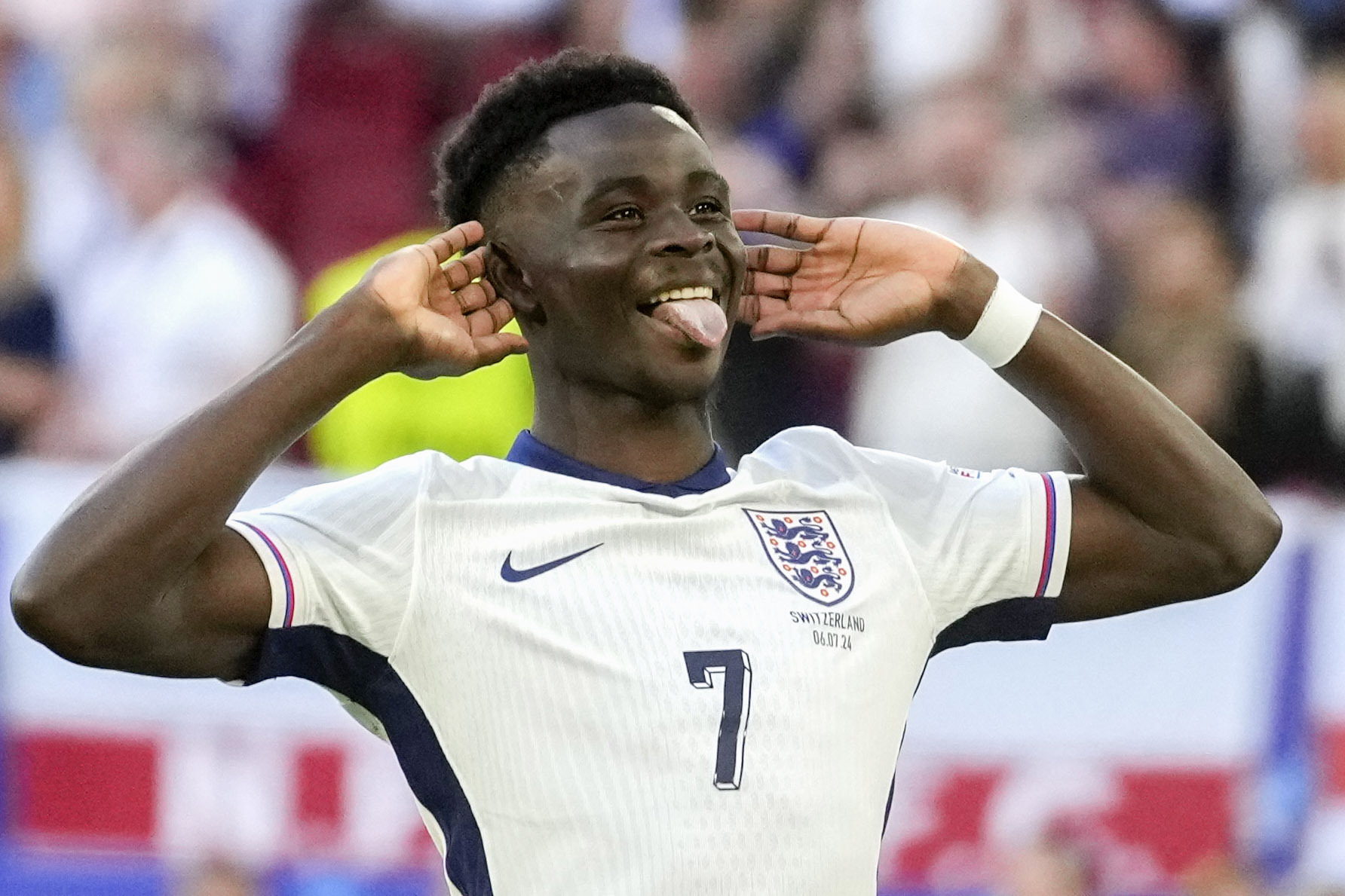England's Bukayo Saka reacts after scoring by penalty during a quarterfinal match between England and Switzerland at the Euro 2024 soccer tournament in Duesseldorf, Germany, Saturday, July 6, 2024. 