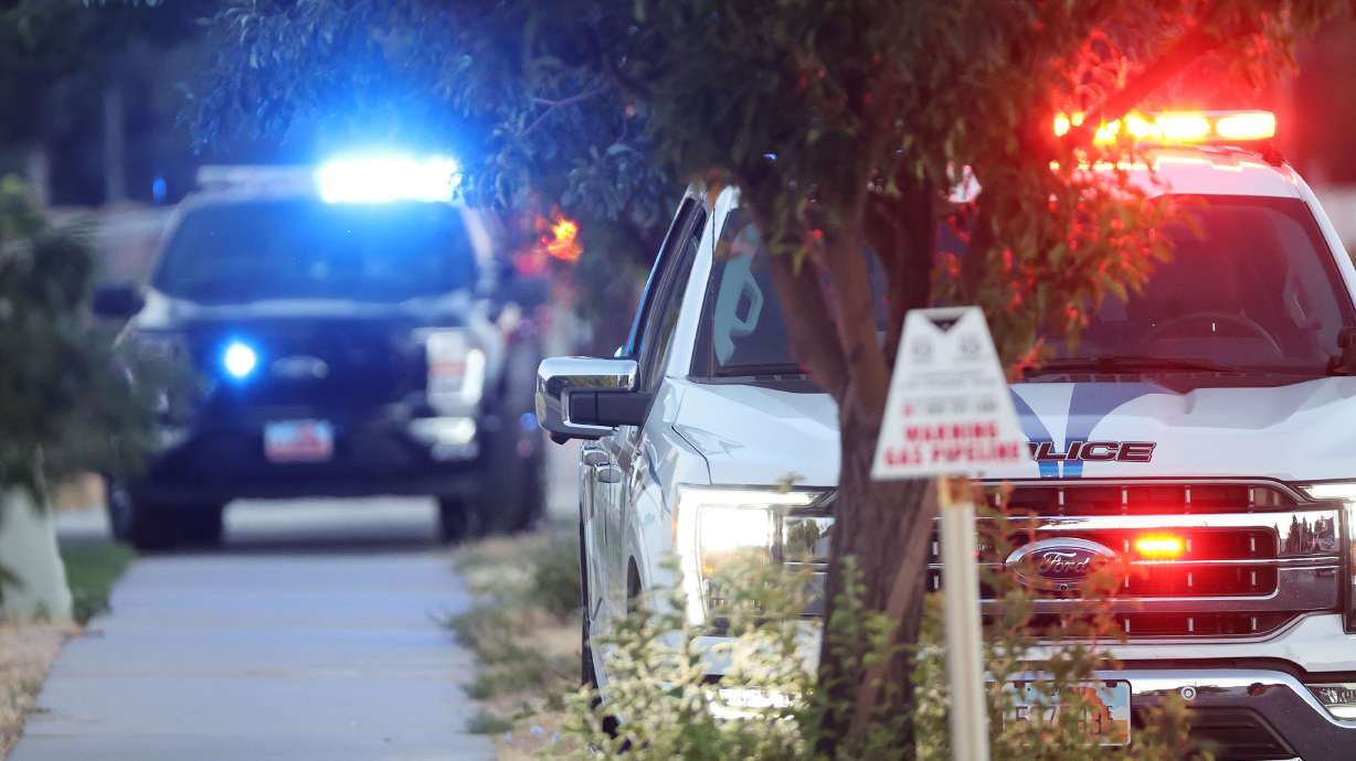 Police respond at the scene of an officer-involved shooting in West Jordan on Friday. The West Jordan Police Department identified the gunman involved in the domestic violence call-turned-police chase and shooting on Saturday and said the man has died.
