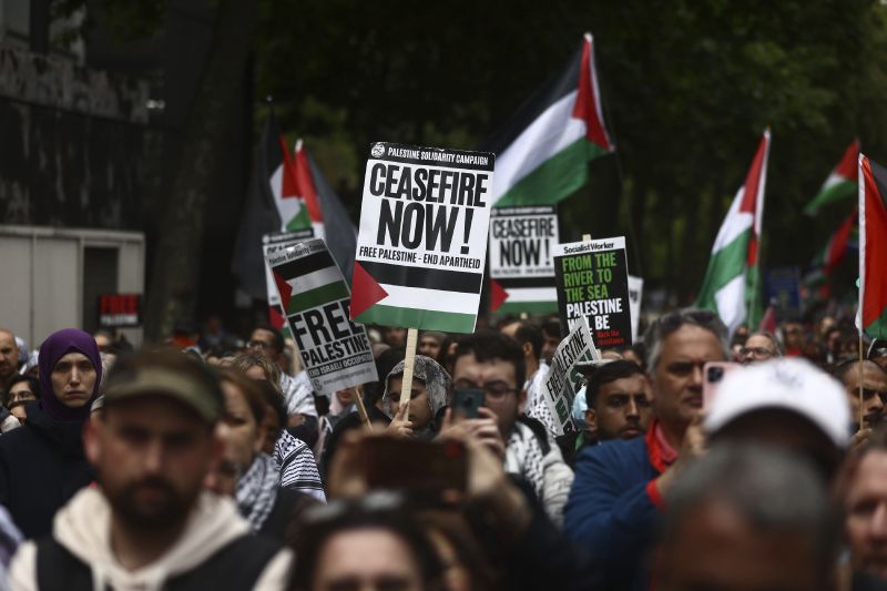 People take part in a pro-Palestinian march in central London, Saturday.