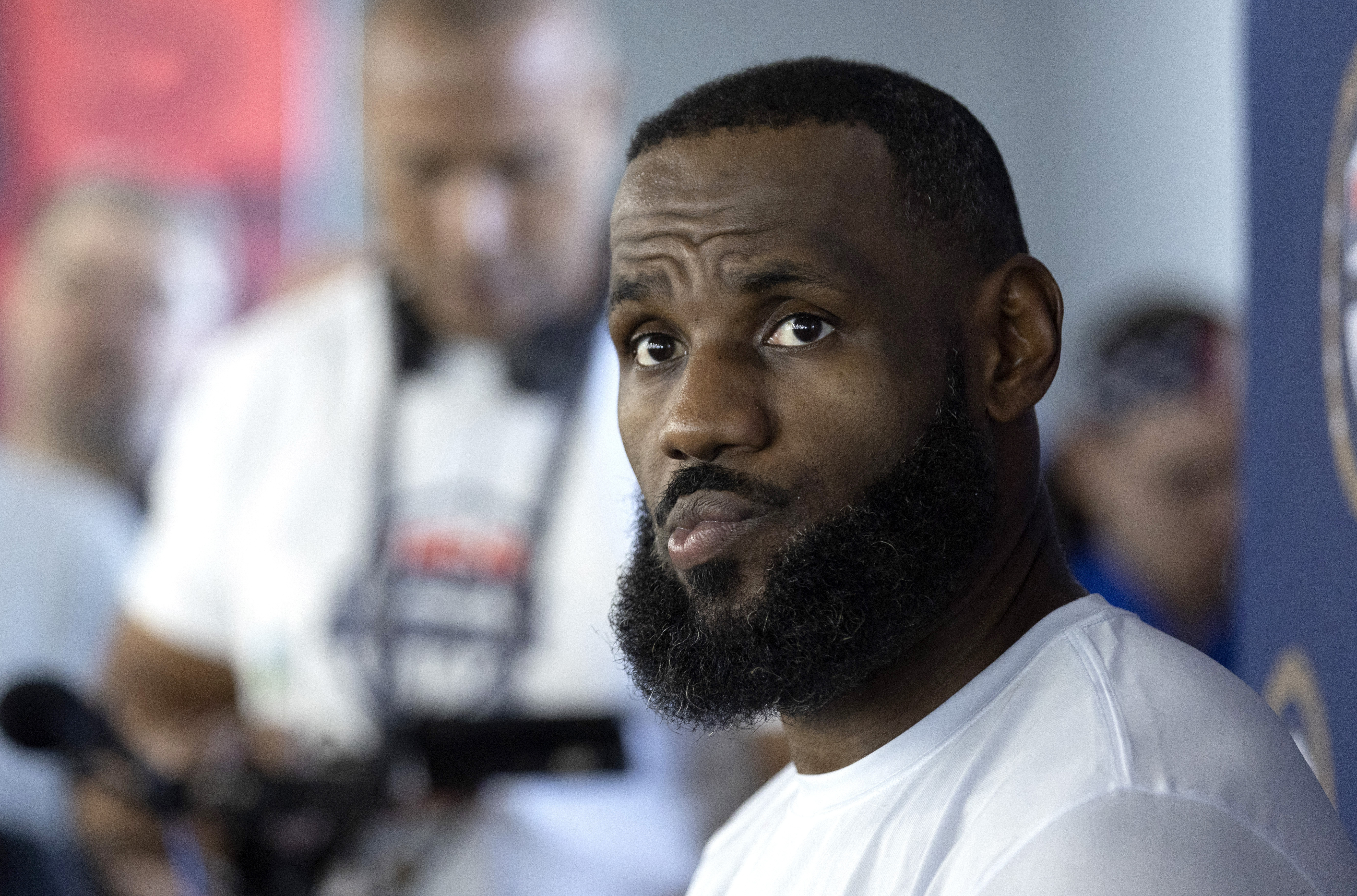 LeBron James of the Los Angeles Lakers listens to a question from a reporter during training camp for the United States men's basketball team Saturday, July 6, 2024, in Las Vegas.