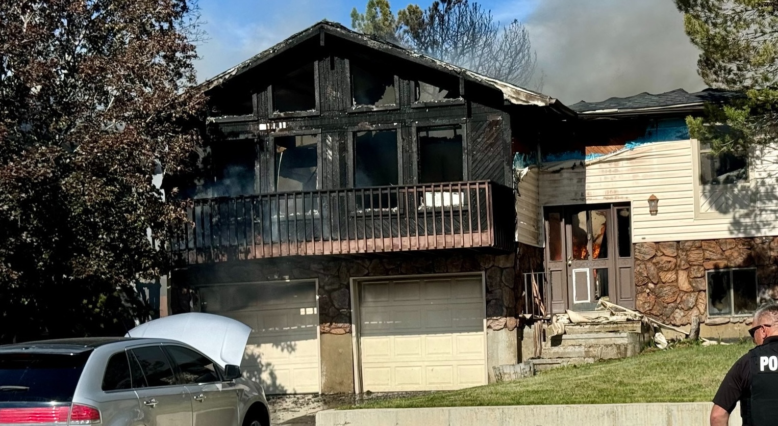 One person was hospitalized and multiple homes in Price are likely a total loss after fire spread through a residential neighborhood on Saturday. Fire investigators say an old, damaged grill is to blame.