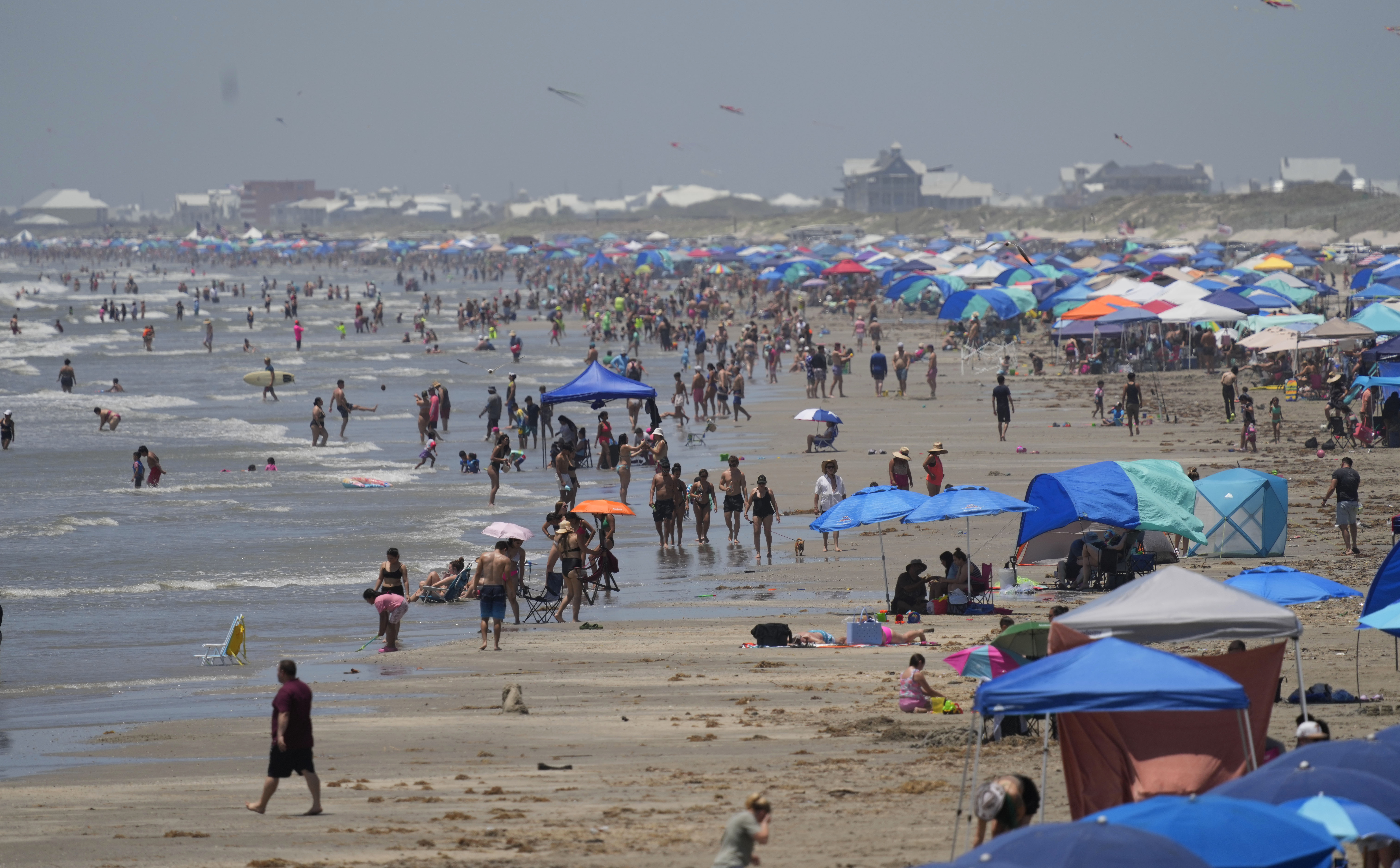 Visitors crowd the beaches, Saturday in Port Aransas, Texas, ahead of Hurricane Beryl's arrival.