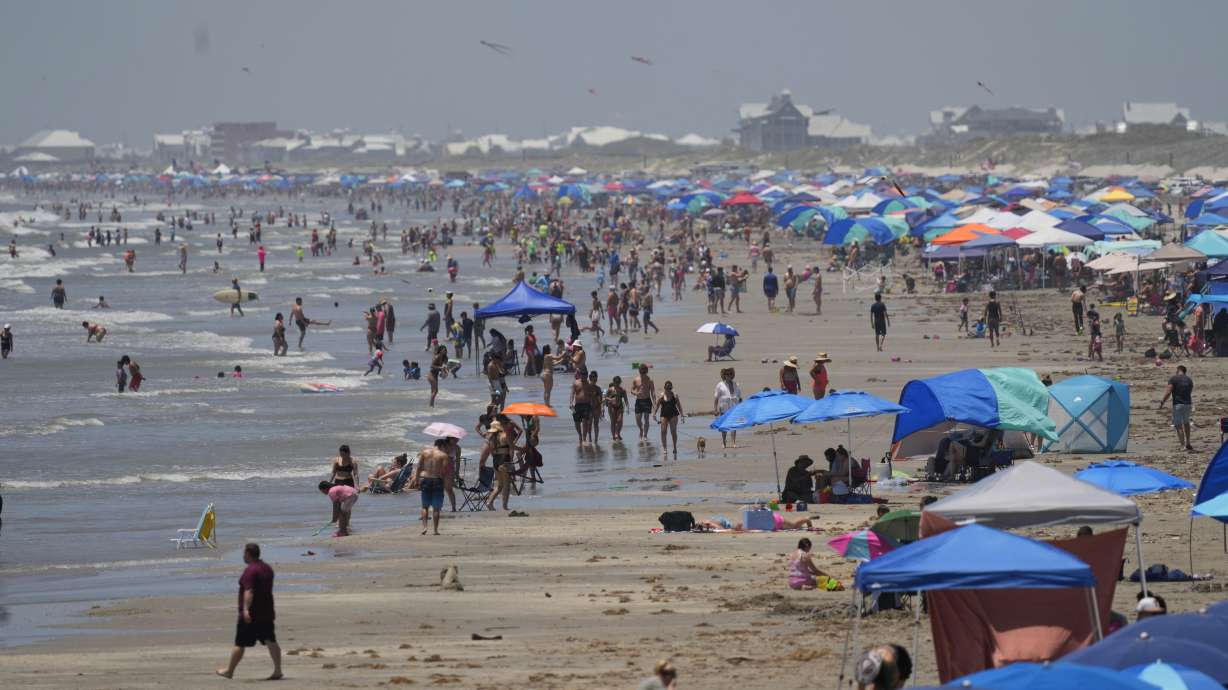 Visitors crowd the beaches, Saturday in Port Aransas, Texas, ahead of Hurricane Beryl's arrival.