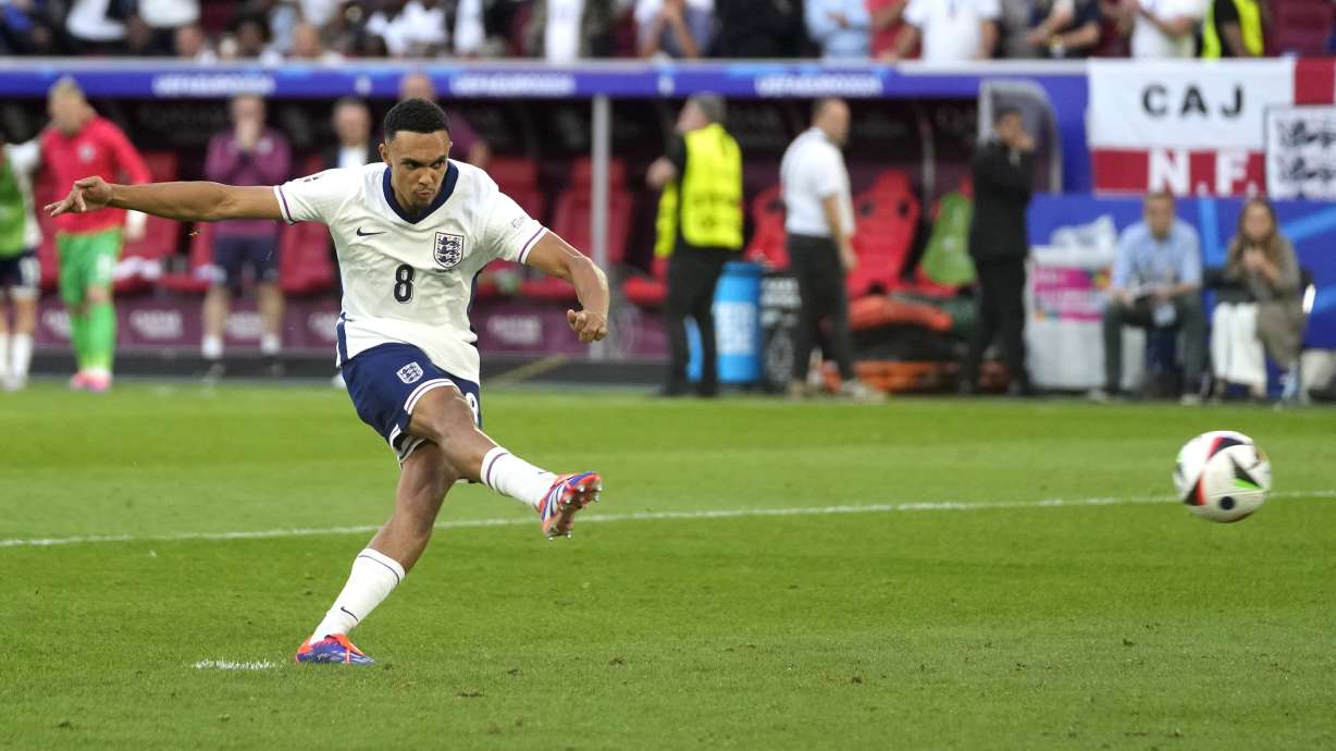 England's Trent Alexander-Arnold scores during the penalty shootout during a quarterfinal match between England and Switzerland at the Euro 2024 soccer tournament in Duesseldorf, Germany, Saturday, July 6, 2024.