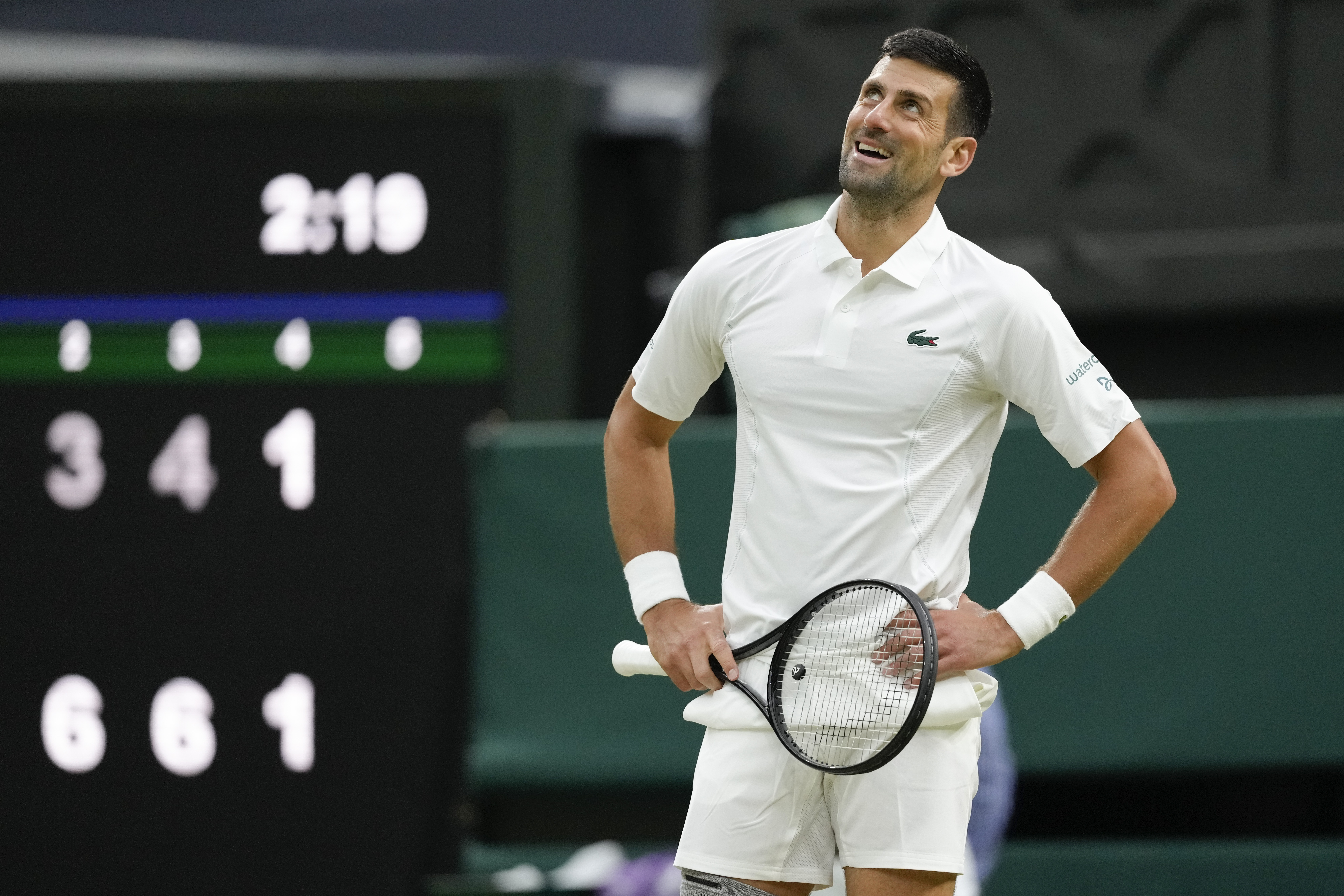 Novak Djokovic of Serbia reacts during his third round match against Alexei Popyrin of Australia at the Wimbledon tennis championships in London, Saturday, July 6, 2024.