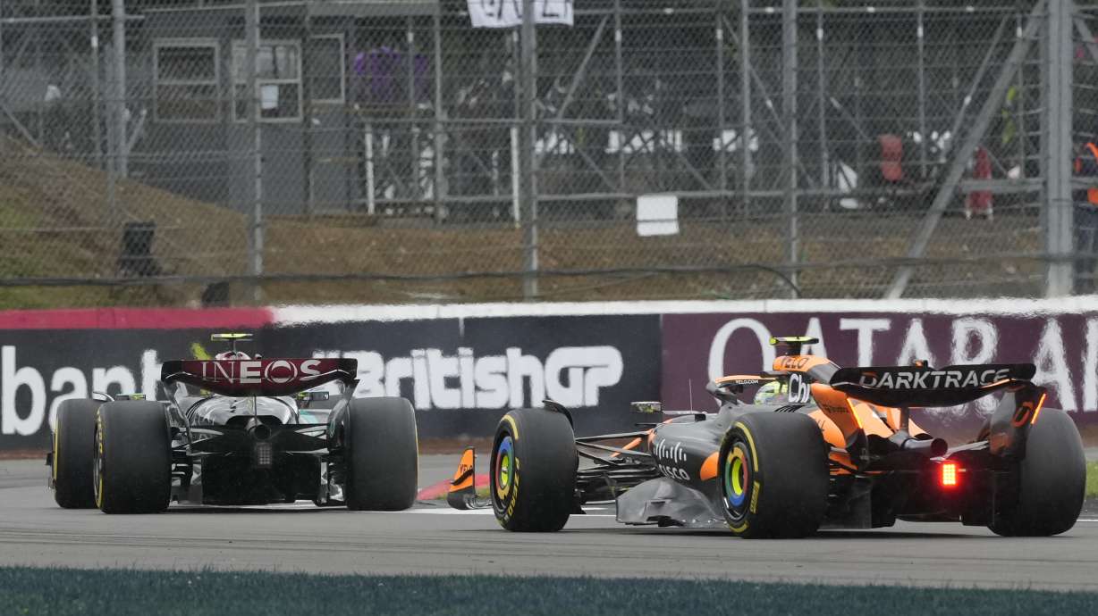 McLaren driver Lando Norris of Britain steers his car behind Mercedes driver Lewis Hamilton of Britain during the British Formula One Grand Prix race at the Silverstone racetrack, Silverstone, England, Sunday, July 7, 2024.