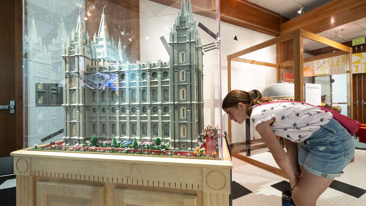 Lainey Black, 12, of Elk Ridge, checks out the Salt Lake Temple in Lego form at the exhibit “Brick upon Brick: Creativity in the Making” located in the Harold B. Lee Library on the campus of Brigham Young University in Provo on Wednesday.