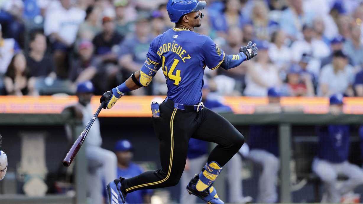 Seattle Mariners' Julio Rodriguez hits a single against the Toronto Blue Jays during the third inning in a baseball game, Friday, July 5, 2024, in Seattle.