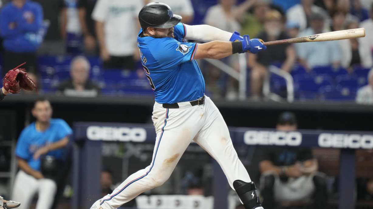 Miami Marlins' Jake Burger hits a walkoff three-run home run during the ninth inning of a baseball game against the Chicago White Sox, Sunday, July 7, 2024, in Miami.