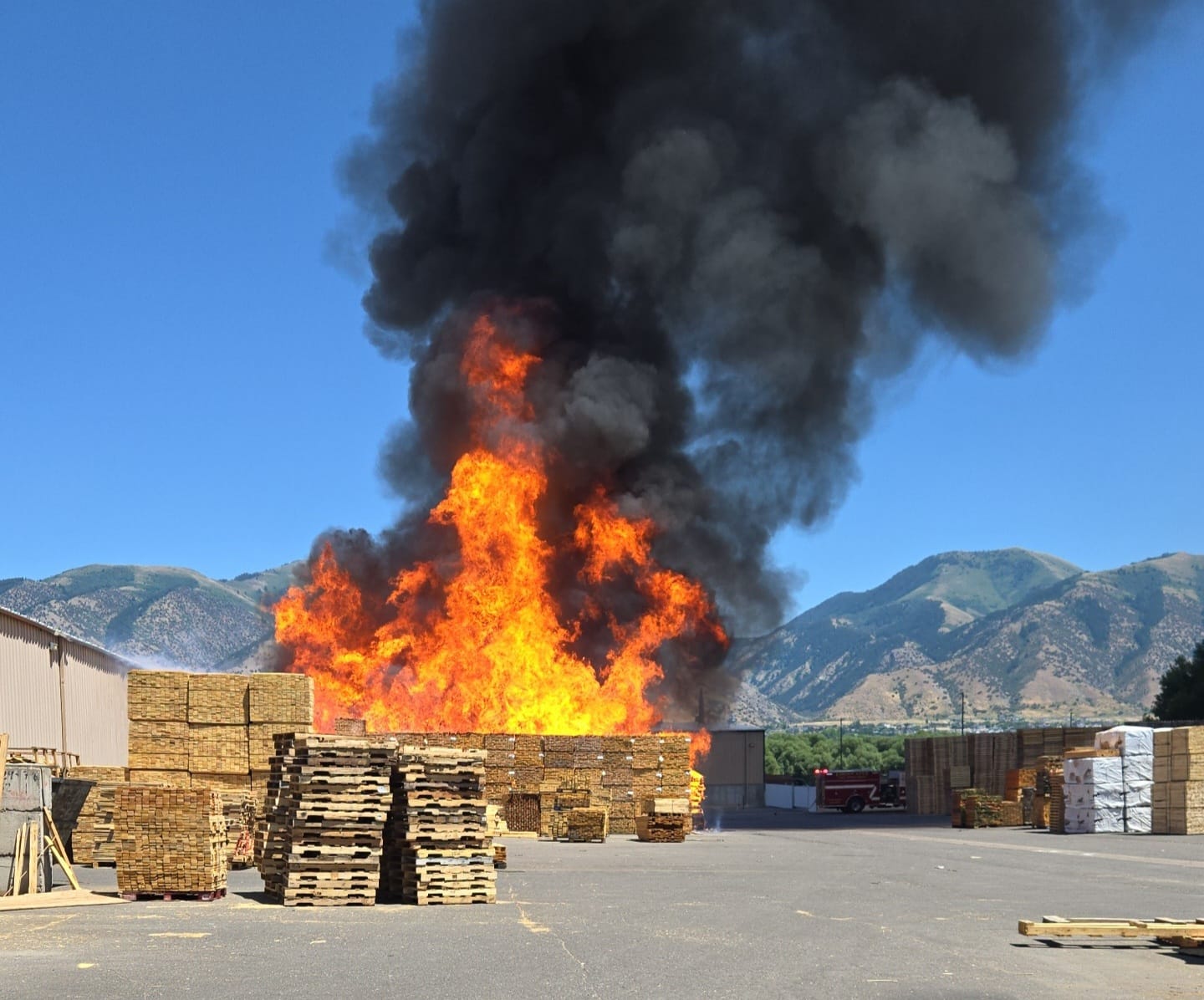 Crews work to put out active fire in Logan