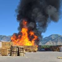 Crews work to put out active fire in Logan