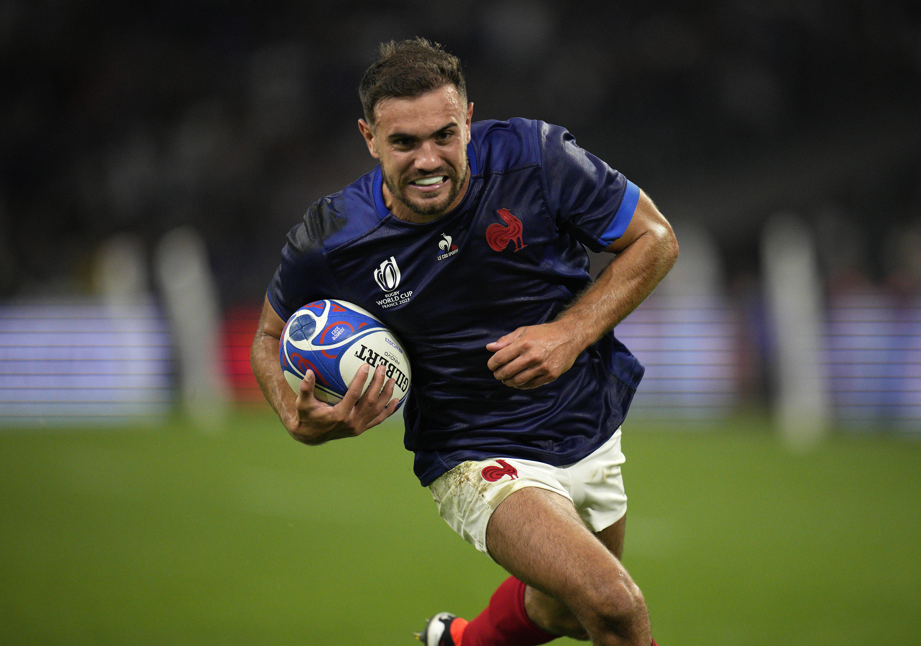 FILE - France's Melvyn Jaminet runs in to score a try during the Rugby World Cup Pool A match against Namibia at the Stade de Marseille in Marseille, France, Sept. 21, 2023. France fullback Jaminet was suspended from the national rugby team Sunday, July 7, 2024, after a video surfaced of the player appearing to make racist remarks. He later apologized.