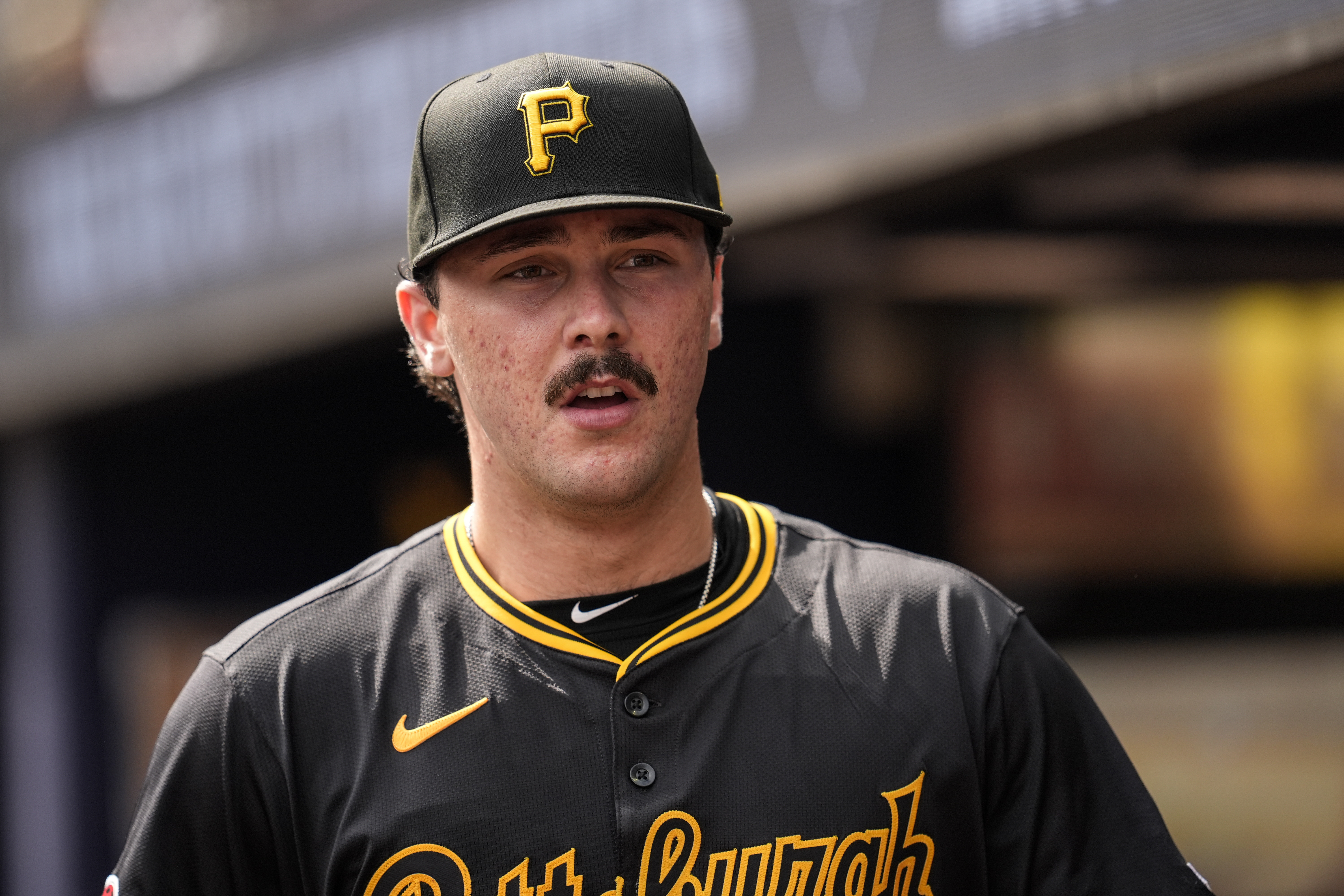 Pittsburgh Pirates pitcher Paul Skenes (30) walks in the dugout in the third inning of a baseball game against the Atlanta Braves, Saturday, June 29, 2024, in Atlanta.