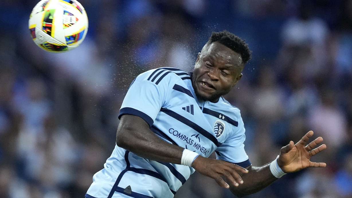 Sporting Kansas City attacker Willy Agada passes the ball during the second half of an MLS soccer match against FC Dallas Sunday, July 7, 2024, in Kansas City, Kan. Sporting Kansas City won 3-2.