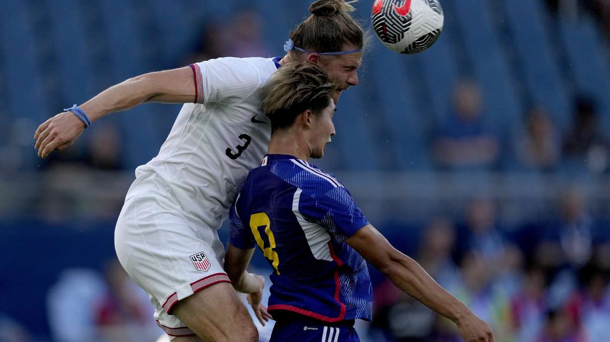 United States defender Walker Zimmerman (3) beats Japan forward Shota Fujio (9) to the ball during the first half of an international friendly under-23 soccer match Tuesday, June 11, 2024, in Kansas City, Kan.