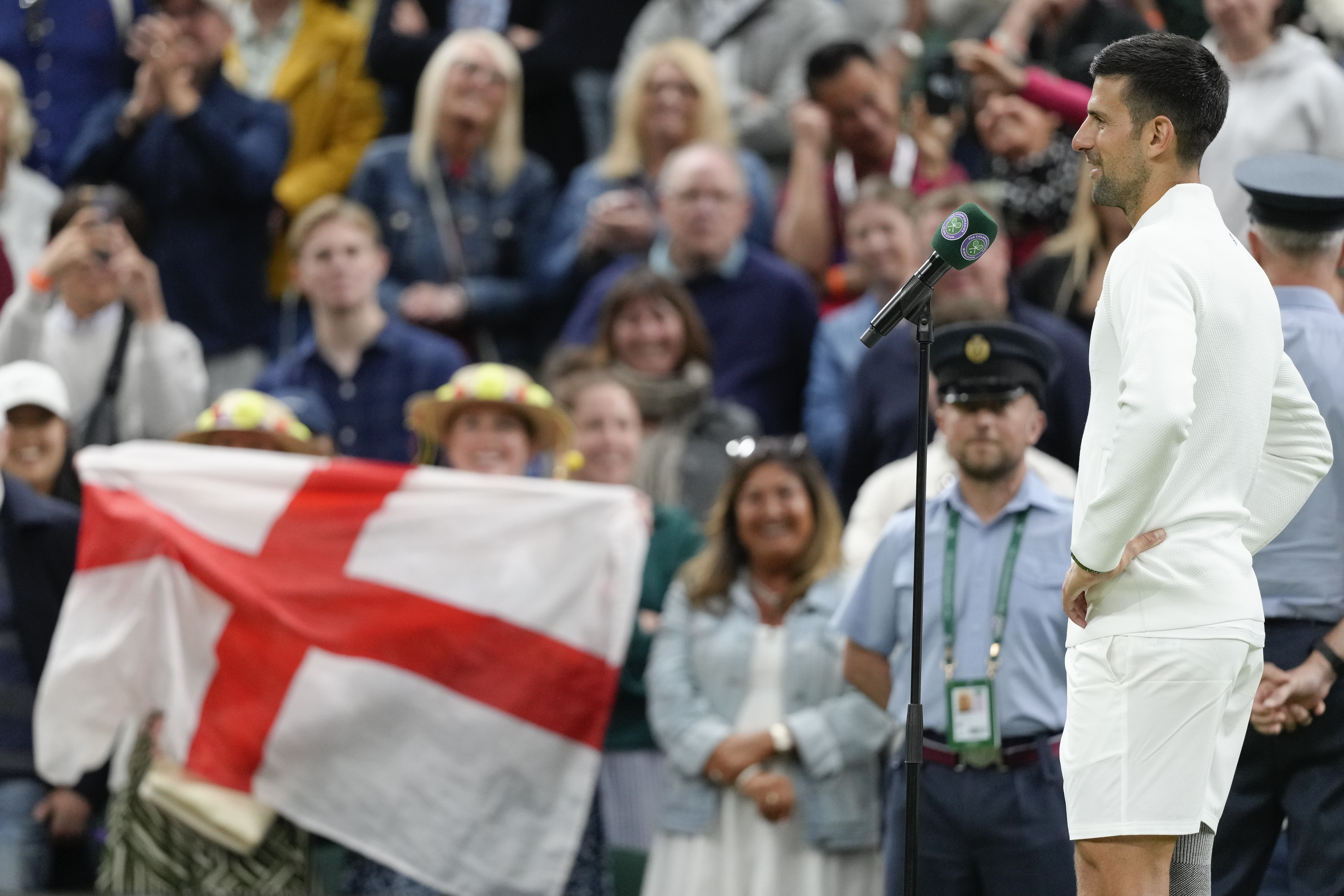 Novak Djokovic of Serbia is interviewed on court following his third round win over Alexei Popyrin of Australia at the Wimbledon tennis championships in London, Saturday, July 6, 2024. 