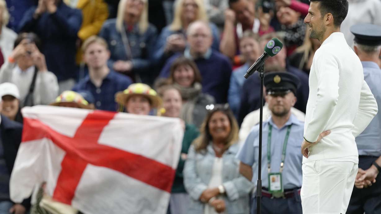 Novak Djokovic of Serbia is interviewed on court following his third round win over Alexei Popyrin of Australia at the Wimbledon tennis championships in London, Saturday, July 6, 2024.