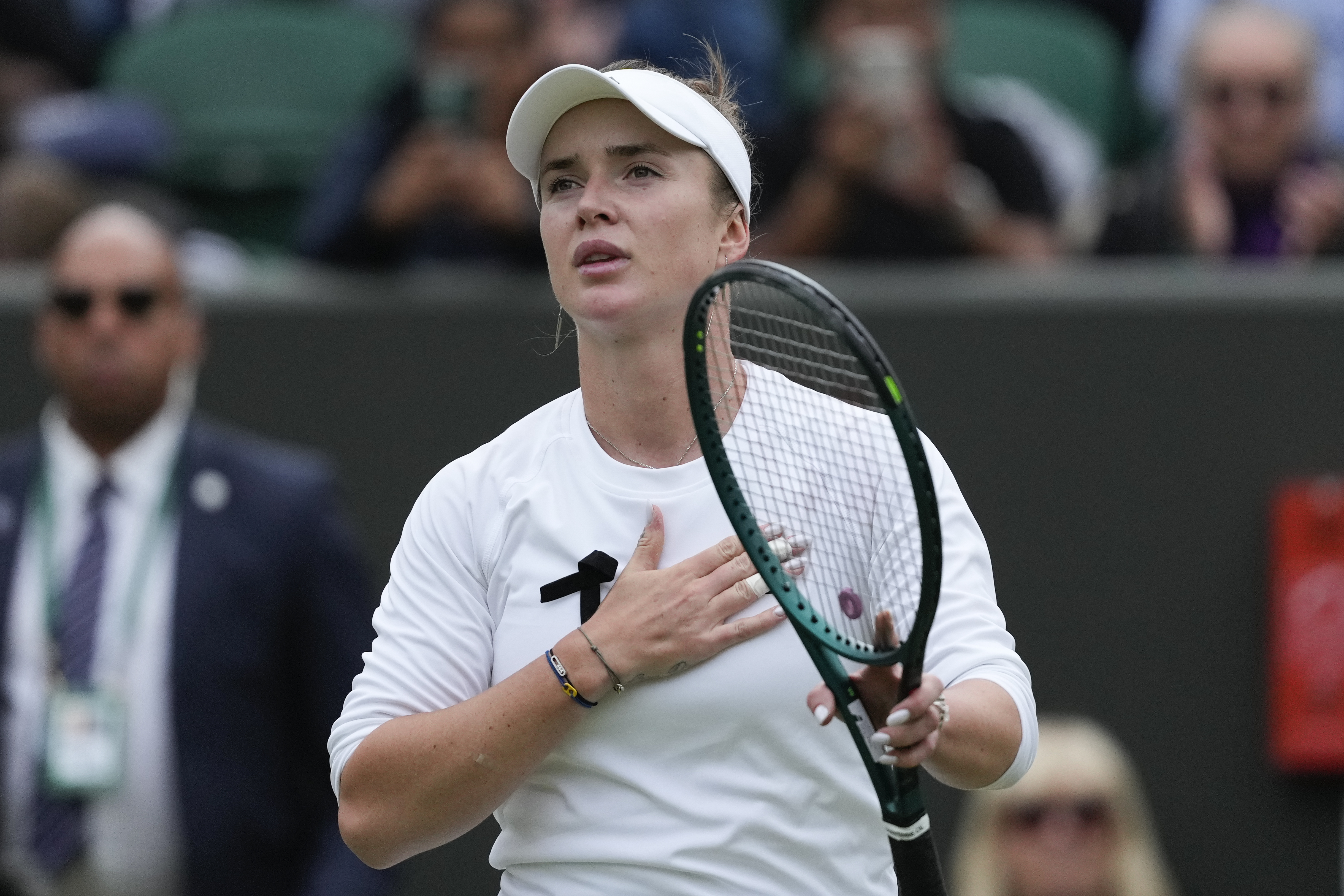 Elina Svitolina of Ukraine reacts after defeating Xinyu Wang of China in their fourth round match at the Wimbledon tennis championships in London, Monday, July 8, 2024.