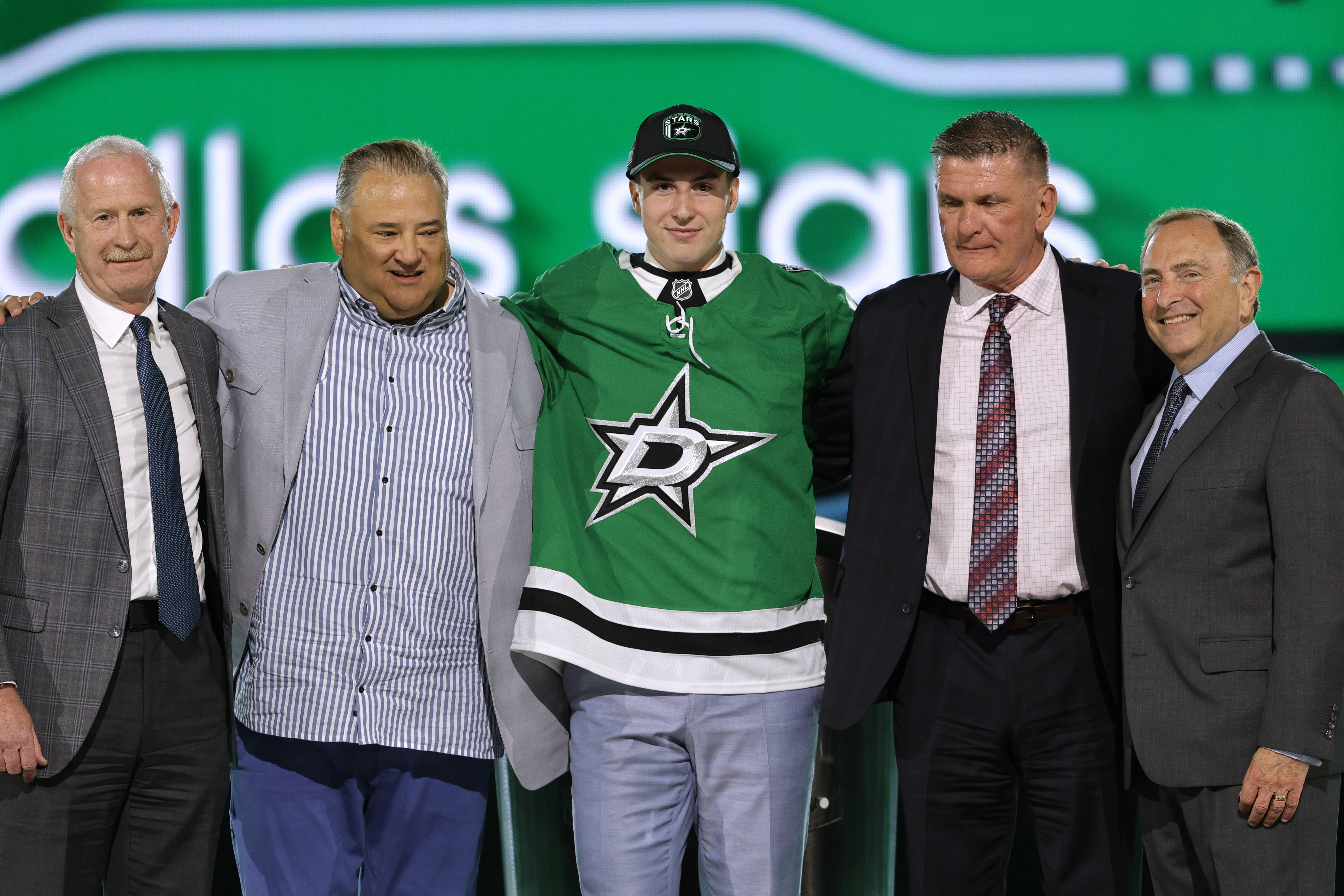 Emil Hemming, center, poses after being selected by the Dallas Stars during the first round of the NHL hockey draft Friday, June 28, 2024, in Las Vegas.