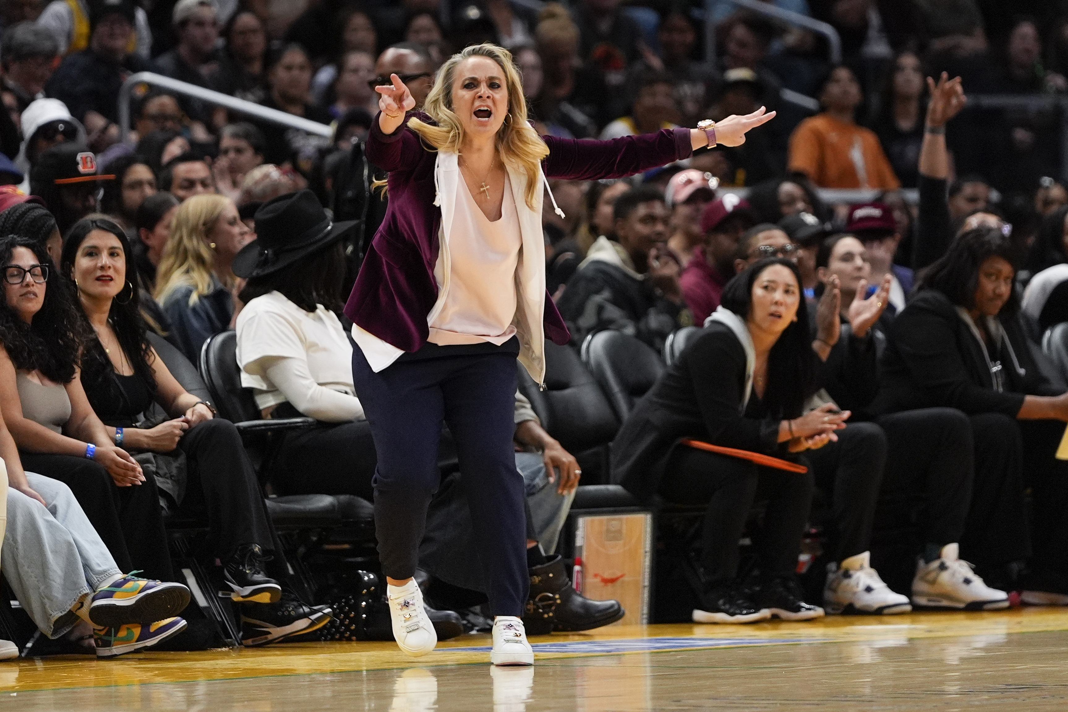 Las Vegas Aces head coach Becky Hammon gestures during the first half of a WNBA basketball game against the Los Angeles Sparks, Sunday, June 9, 2024, in Los Angeles.
