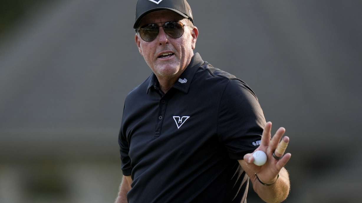 Phil Mickelson waves after making a putt on the ninth hole during the second round of the U.S. Open golf tournament Friday, June 14, 2024, in Pinehurst, N.C.