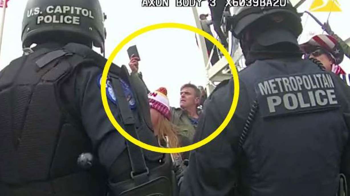 Jay James Johnston, circled in yellow, is seen at the U.S. Capitol on Jan. 6, 2021, in Washington. Johnston, an actor pleaded guilty to interfering with police officers.