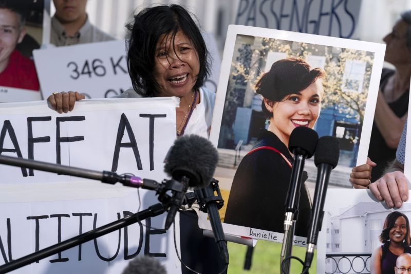 Clariss Moore, parent of Danielle, one of the crash victims of a Boeing 737 Max 8 in Ethiopia, holds her photograph while speaking at a news conference on Capitol Hill, June 18 in Washington.