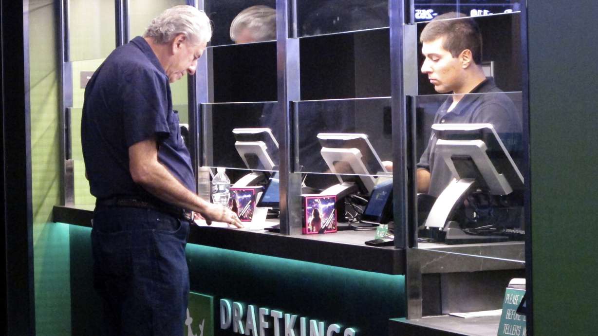 A man makes a sports bet at the DraftKings sports book in Atlantic City, N.J., Oct. 8, 2019. New Jersey regulators fined DraftKings $100,000 on June 17, 2024 for reporting inaccurate sports betting data to the state, leading to the correction and reposting of New Jersey sports betting data in Dec. 2023 and January and Feb. 2024.