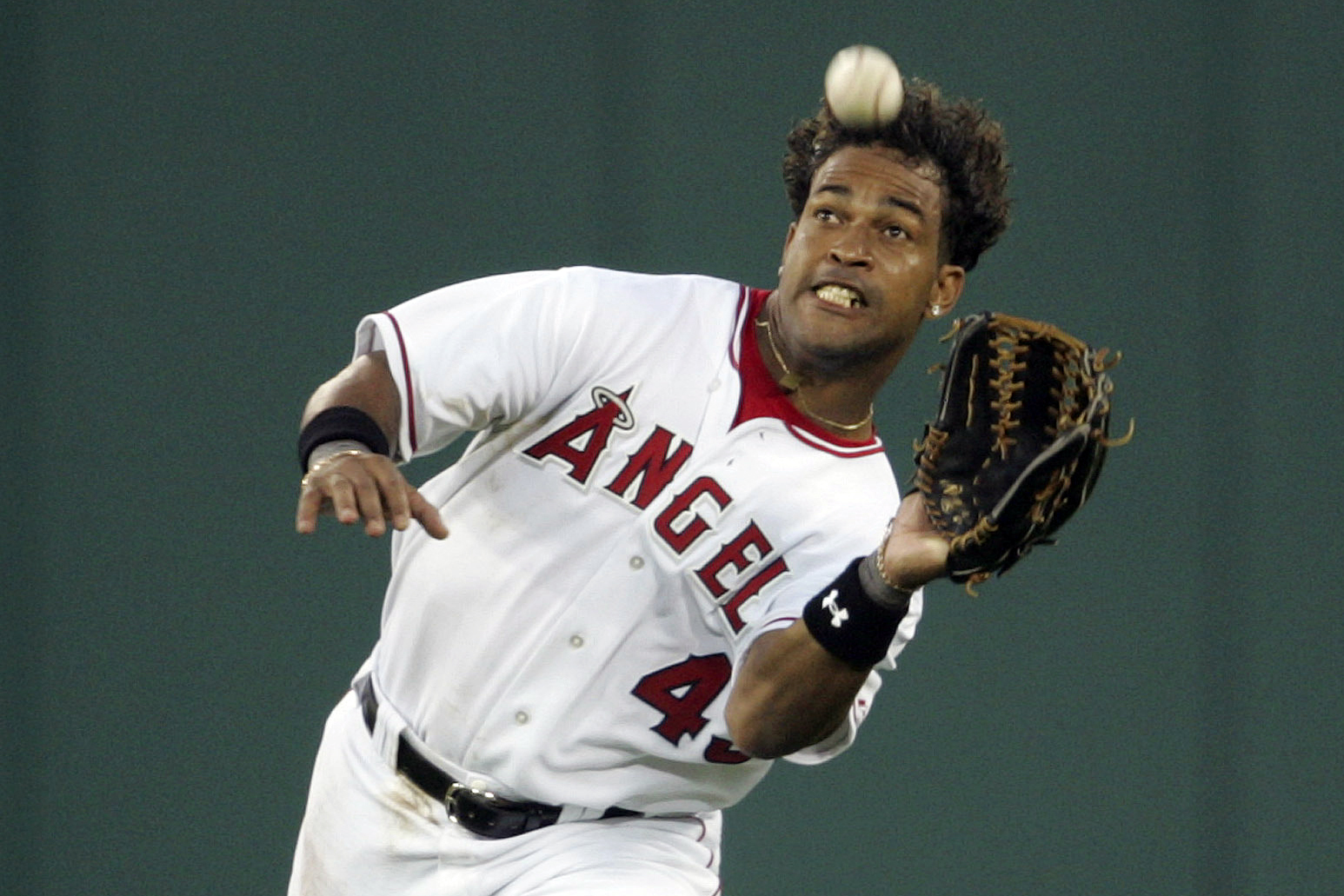 FILE- Anaheim Angels center fielder Raul Mondesi catches a ball hit by Boston Red Sox's Kevin Youkilis in the second inning at Angel Stadium in Anaheim, Calif., in this June 1, 2004 photo. Former baseball player Raúl Mondesi was sentenced Friday, July 5, 2024, by a Dominican court to six years and nine months in jail and fined $507,000 for corruption during his time as mayor in the city of San Cristobal. 