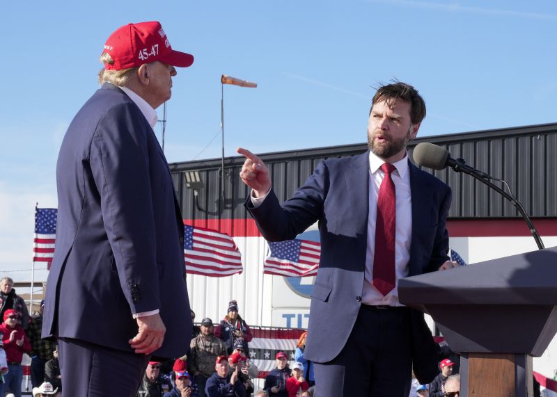 Sen. J.D. Vance, R-Ohio, right, points toward Republican presidential candidate former President Donald Trump at a campaign rally, March 16, in Vandalia, Ohio. Vance is a top contender to be selected as Trump's running mate.