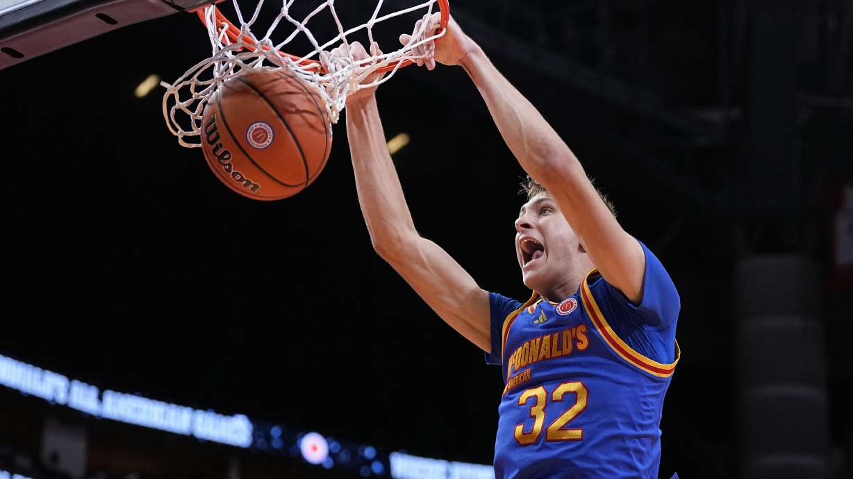 FILE - East forward Cooper Flagg dunks on a fast break during the third quarter of the McDonald's All American boys' basketball game Tuesday, April 2, 2024, in Houston. The incoming Duke freshman is among the potential headliners for the 2025 NBA draft.