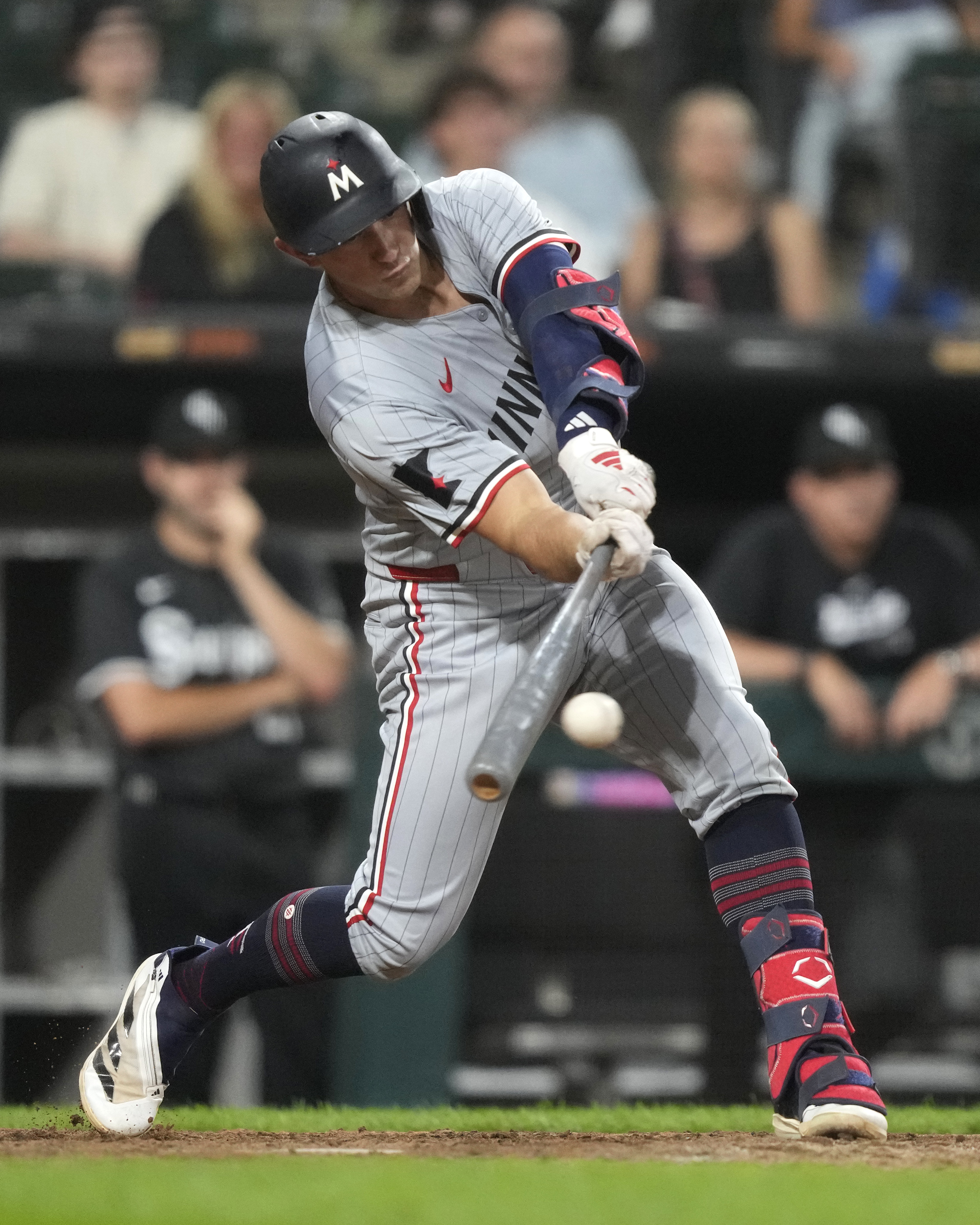 Minnesota Twins' Brooks Lee hits an RBI single in the 11th inning of a baseball game against the Chicago White Sox, Monday, July 8, 2024, in Chicago. 