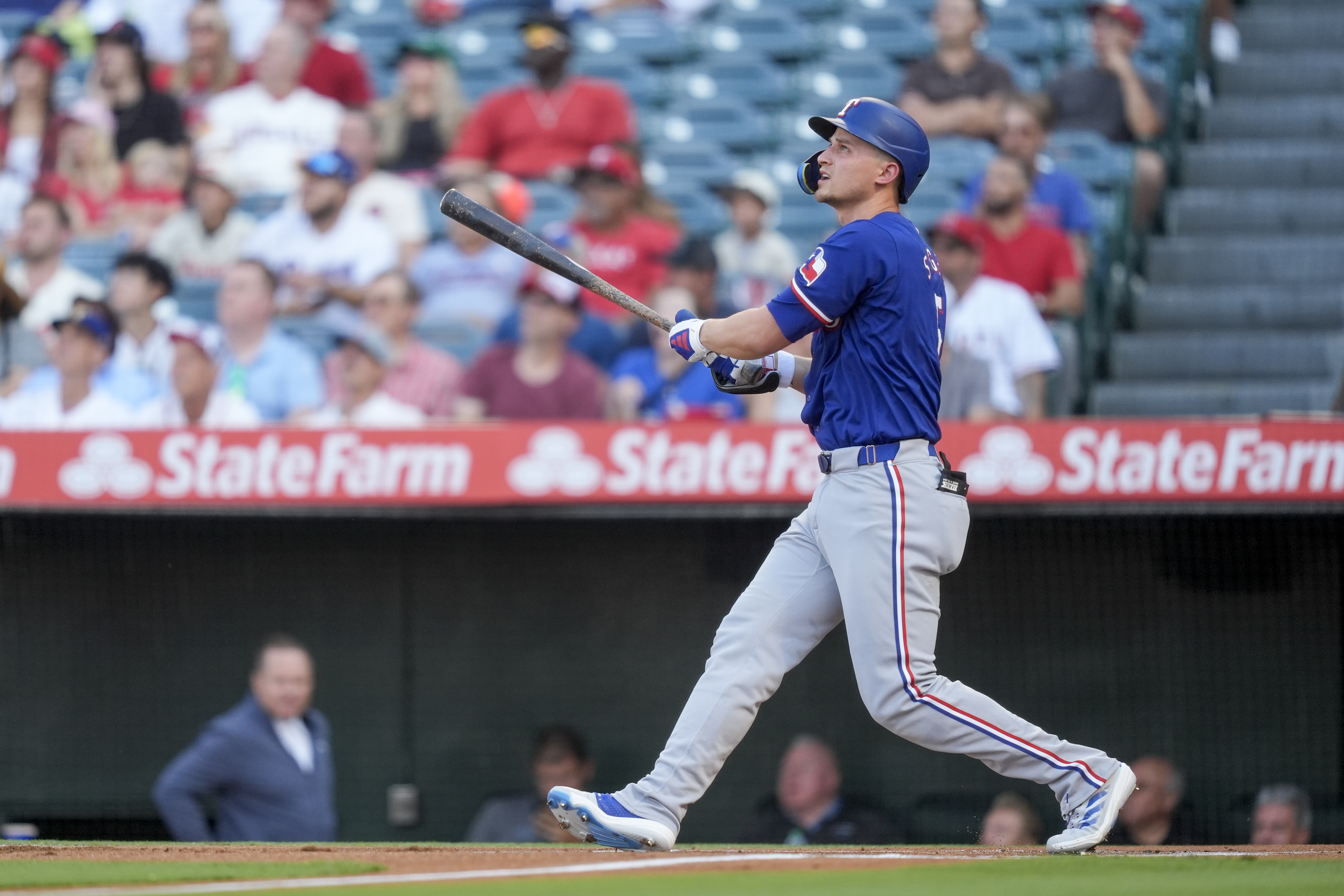 Texas Rangers' Corey Seager watches his two-run home run during the first inning of a baseball game against the Los Angeles Angels, Monday, July 8, 2024, in Anaheim, Calif. 