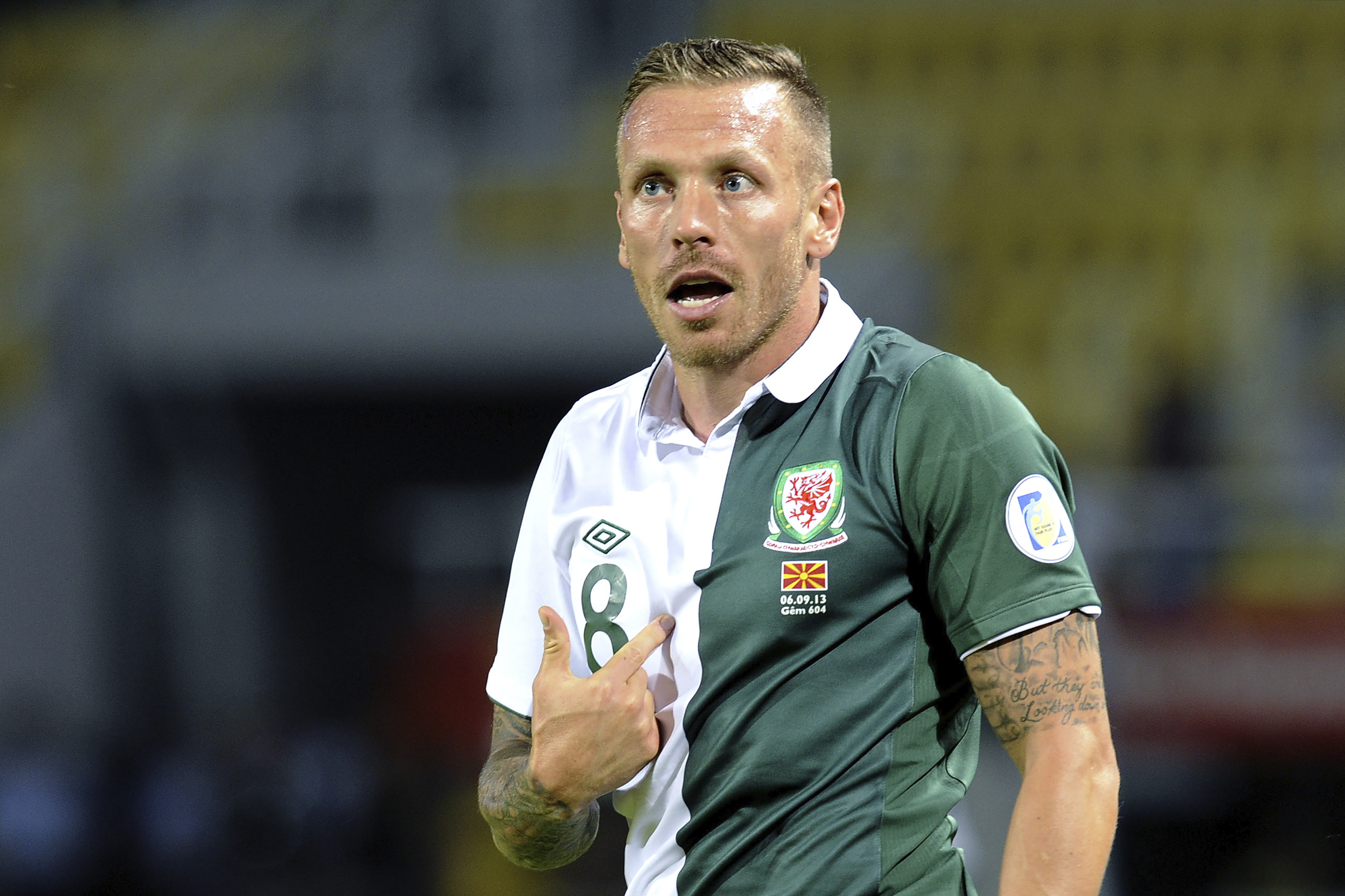 FILE - Wales player Craig Bellamy reacts during a World Cup 2014 Group A qualifying soccer match against Macedonia, at Philip II arena in Skopje, Macedonia, on Sept. 6, 2013. Former Wales captain Craig Bellamy was hired to coach the national team on a contract until 2028 on Tuesday. 