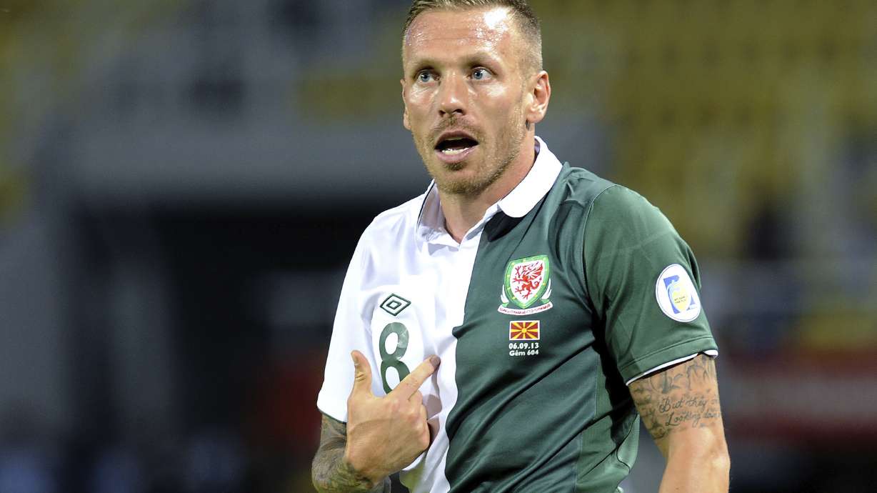 FILE - Wales player Craig Bellamy reacts during a World Cup 2014 Group A qualifying soccer match against Macedonia, at Philip II arena in Skopje, Macedonia, on Sept. 6, 2013. Former Wales captain Craig Bellamy was hired to coach the national team on a contract until 2028 on Tuesday.
