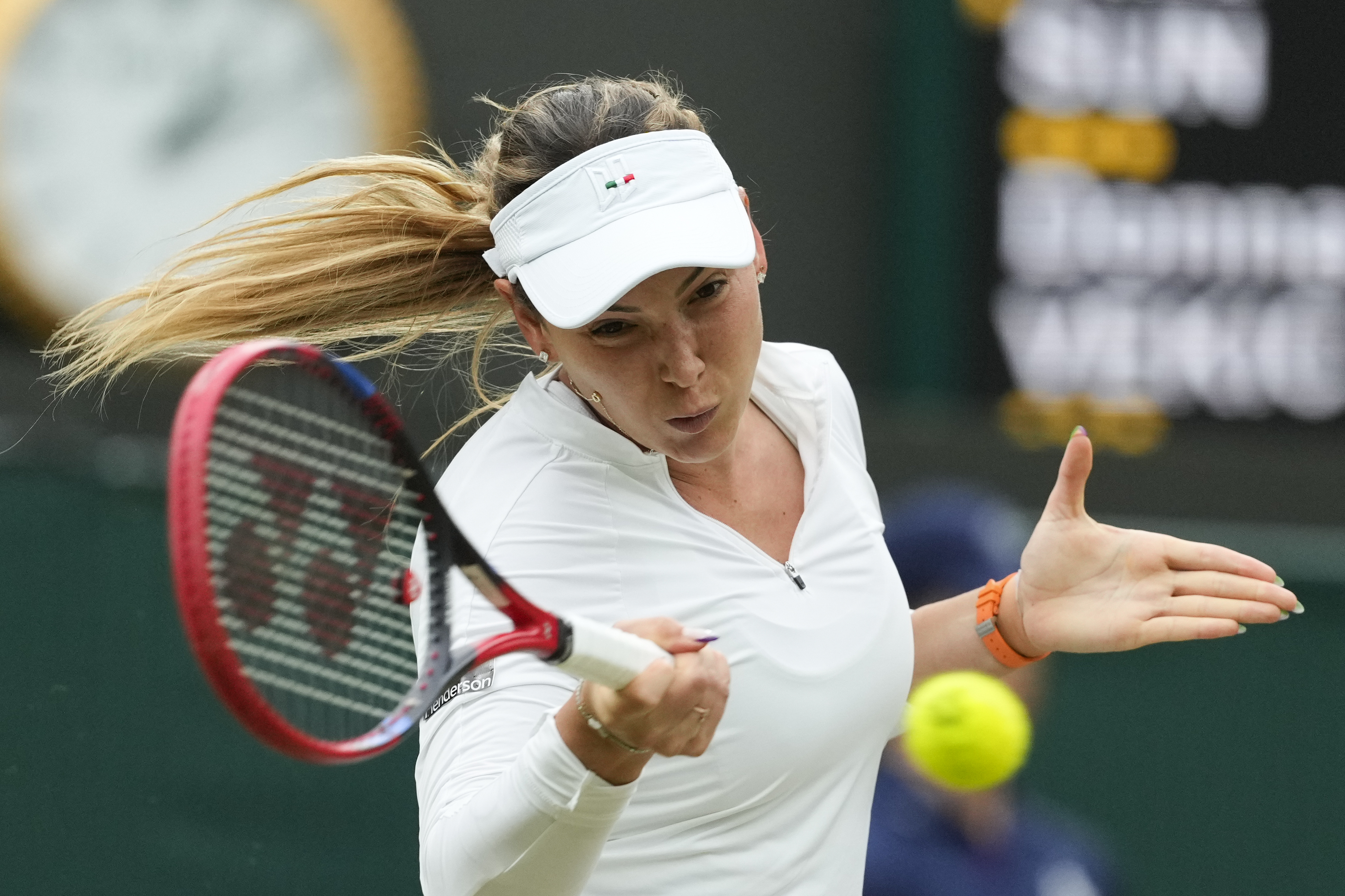 Donna Vekic of Croatia plays a forehand return to Lulu Sun of New Zealand during their quarterfinal match at the Wimbledon tennis championships in London, Tuesday, July 9, 2024. 