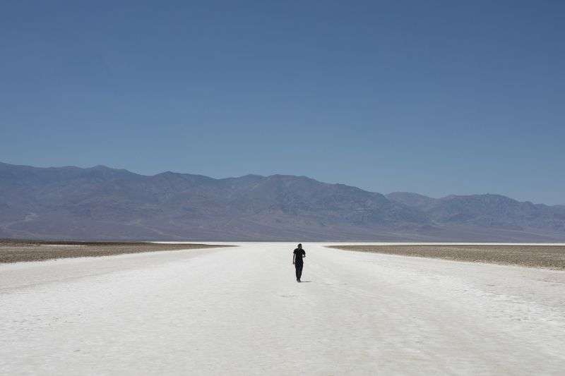 Sheik Mabrouki, of Algeria, walks through Badwater Basin, Monday in Death Valley National Park, Calif.