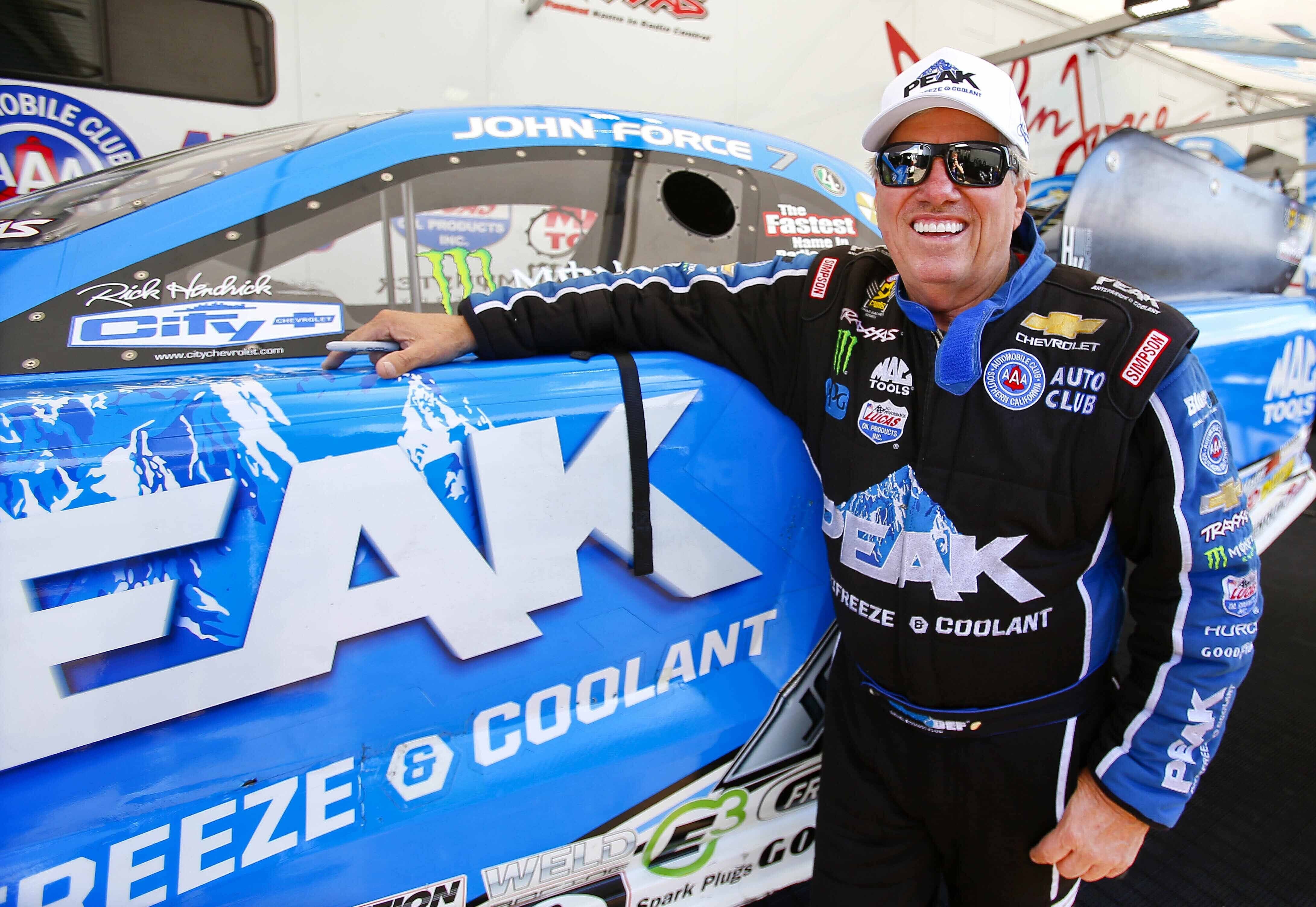 FILE - Funny Car driver John Force looks to get back on track for the last day of qualifying at the NHRA Kansas Nationals at Heartland Park, May 21, 2016, in Topeka Kansas. 