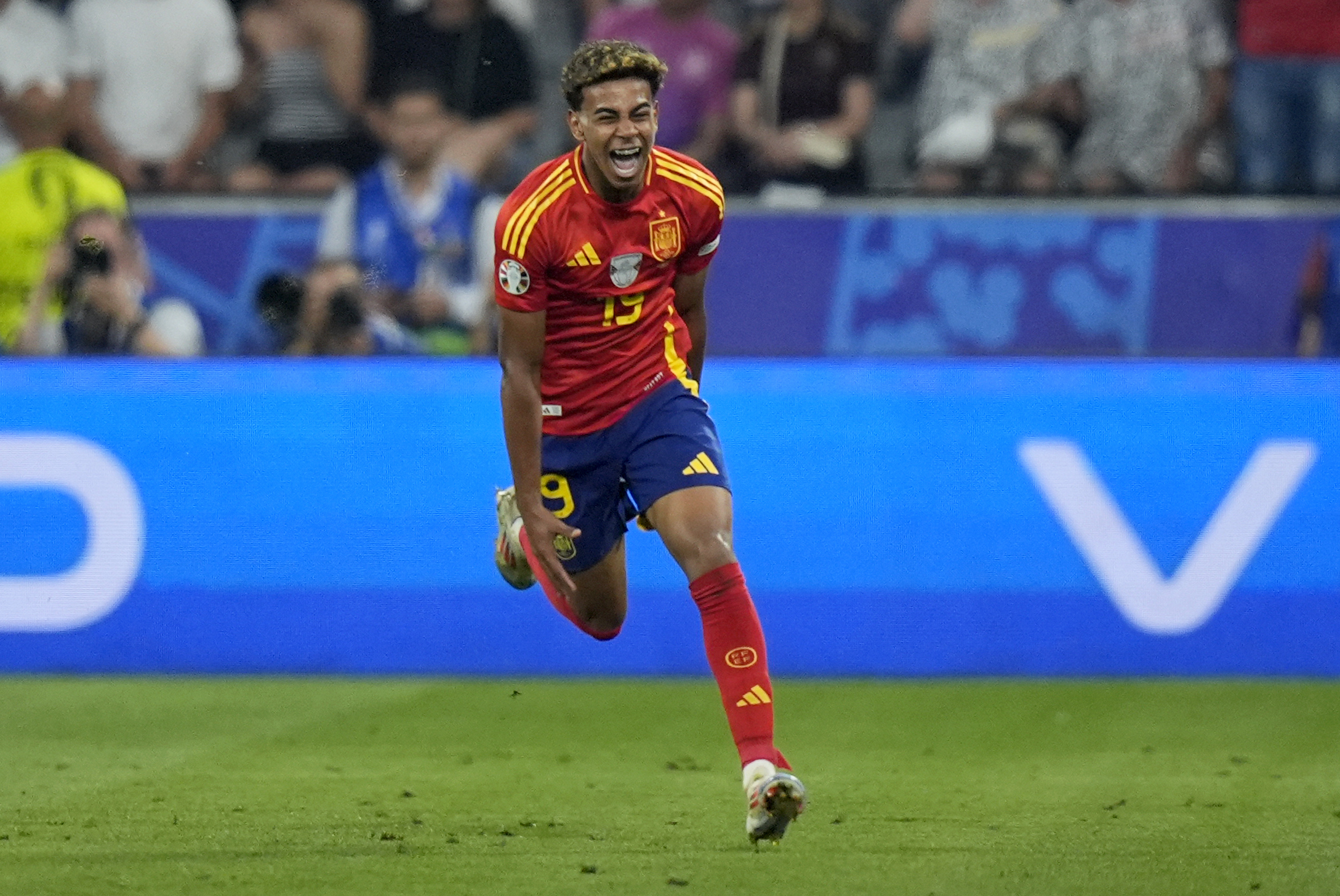Spain's Lamine Yamal celebrates after scoring his side's first goal during a semifinal match between Spain and France at the Euro 2024 soccer tournament in Munich, Germany, Tuesday, July 9, 2024. 