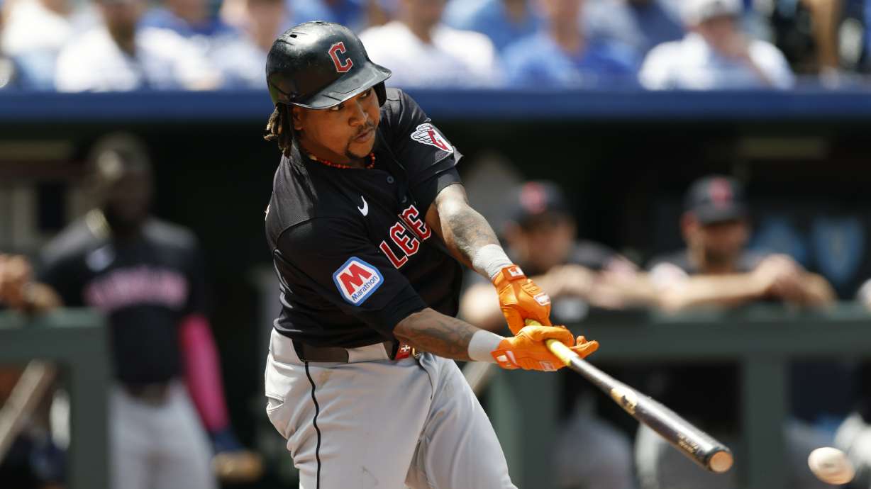 Cleveland Guardians' Jose Ramirez hits an RBI double during the eighth inning of a baseball game against the Kansas City Royals in Kansas City, Mo., Sunday, June 30, 2024.