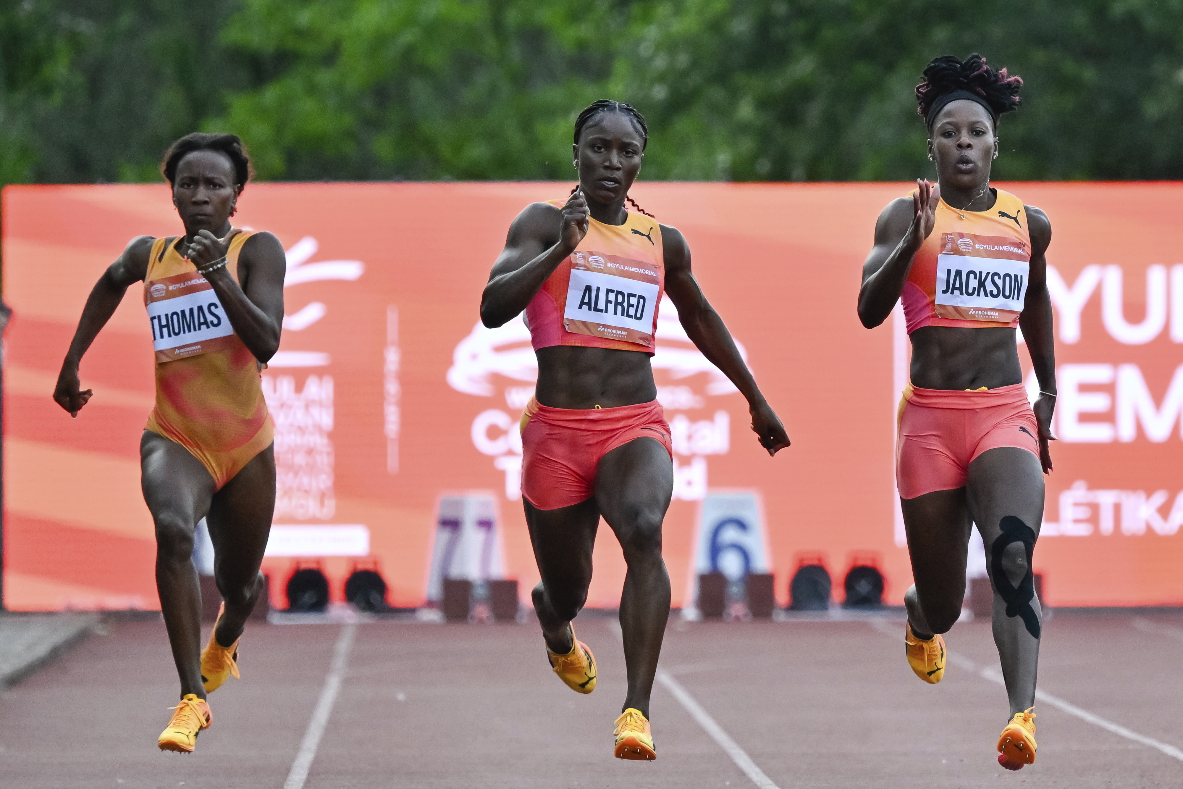 Lanea-Tava Thomas, left, of Jamaica, Julien Alfred, center, of Saint Lucia, and Shericka Jackson, right, of Jamaica, compete in the 200 meter event at the Gyulai Istvan Memorial Track and Field Hungarian Grand Prix in Szekesfehervar, Hungary, Tuesday, July 9, 2024. Julien Alfred, center, of Saint Lucia, won the race. 