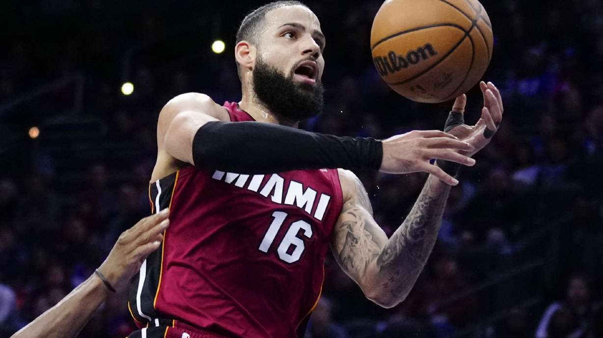 FILE - Miami Heat's Caleb Martin (16) goes up for a shot during the first half of an NBA basketball game, Monday, March 18, 2024, in Philadelphia.
