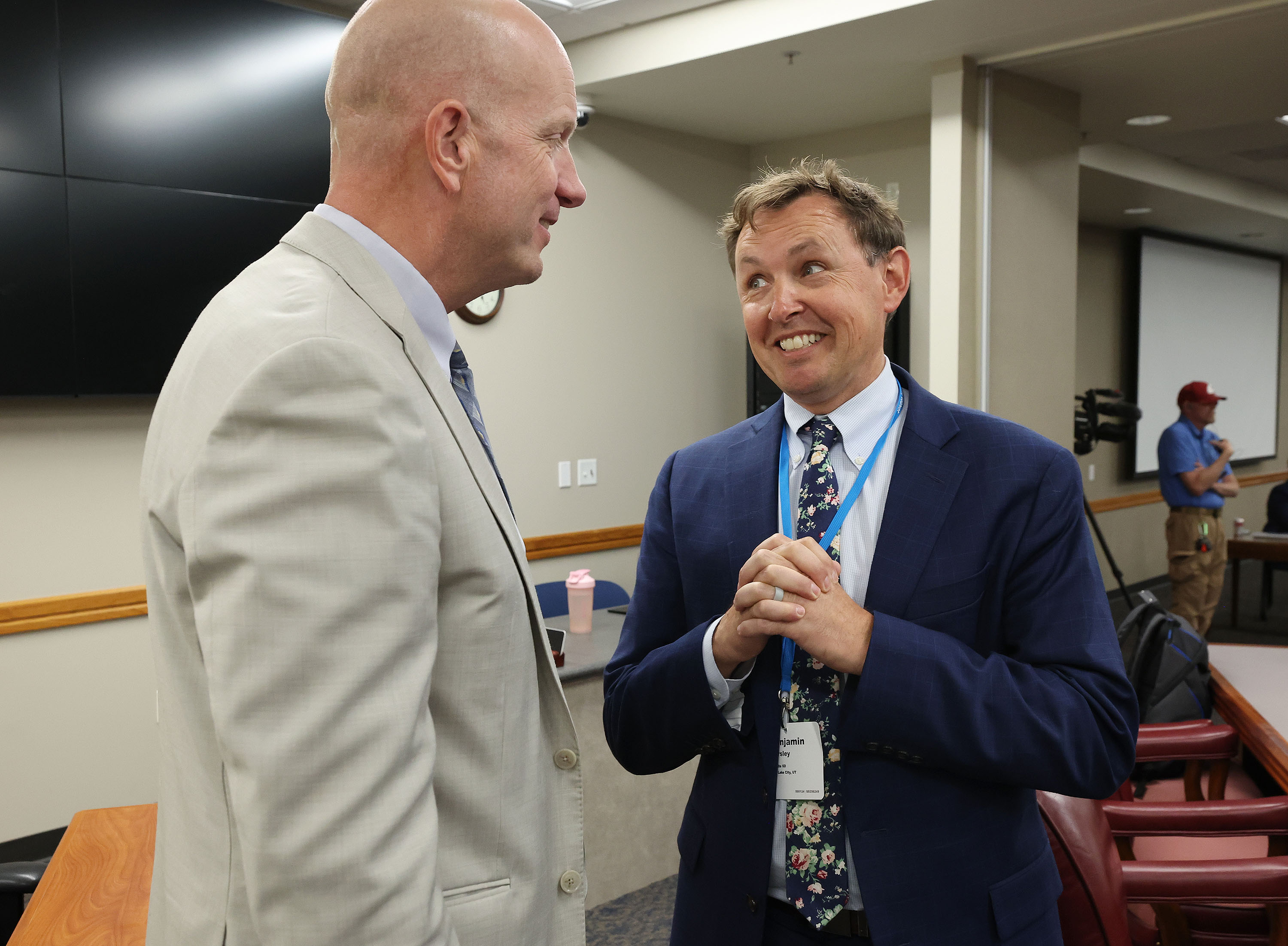 Ben Horsley, right, is appointed new superintendent and talks with former Superintendent Richard Nye during a special session in Salt Lake City on Tuesday.