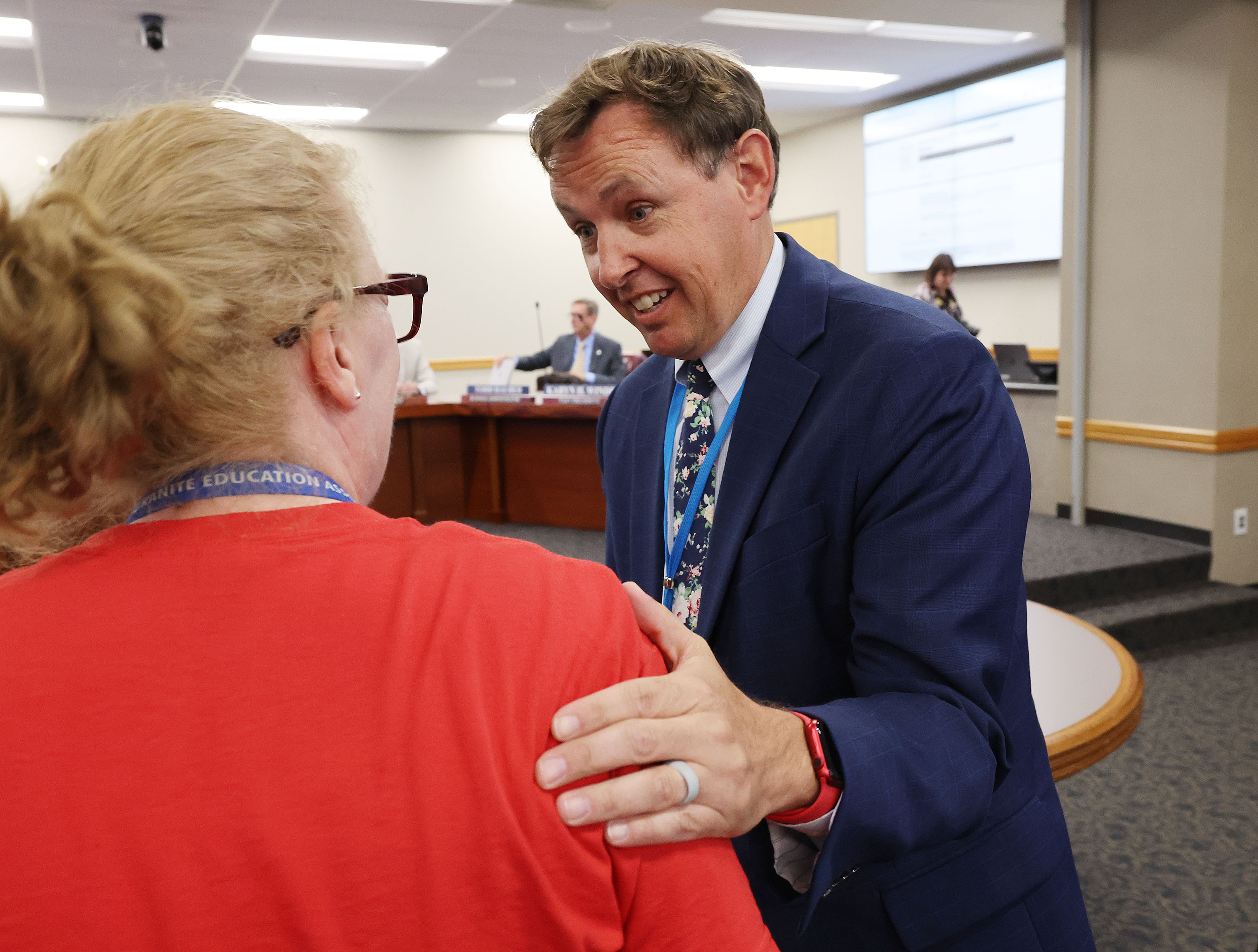 Ben Horsley talks with Jessica Dunn, executive director of Granite Education Association, after being appointed new superintendent at the Granite School District Board of Education during a special session in Salt Lake City on Tuesday.