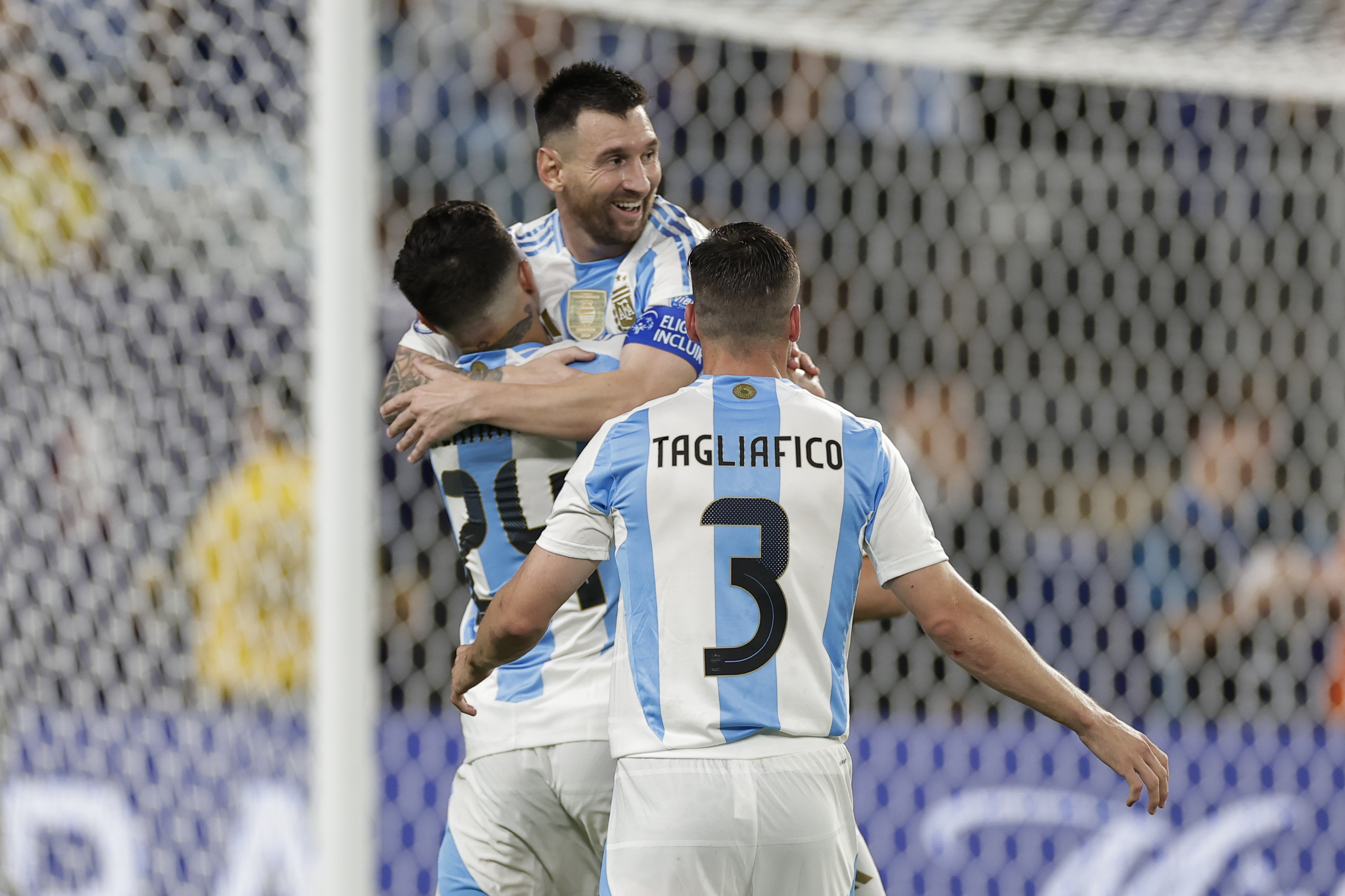Argentina's Lionel Messi is congratulated after scoring his side's second goal against Canada during a Copa America semifinal soccer match in East Rutherford, N.J., Tuesday, July 9, 2024. 
