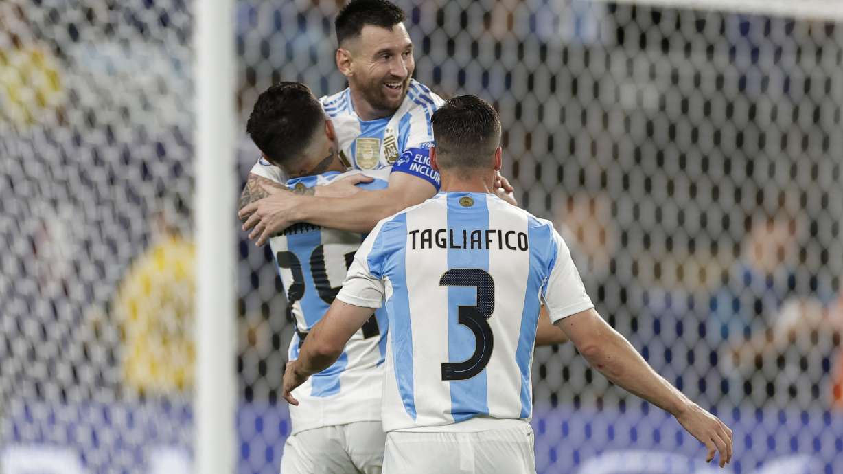 Argentina's Lionel Messi is congratulated after scoring his side's second goal against Canada during a Copa America semifinal soccer match in East Rutherford, N.J., Tuesday, July 9, 2024.