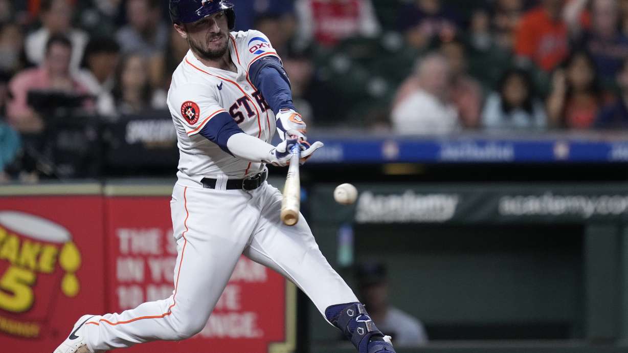 Houston Astros' Alex Bregman hits an RBI single during the fifth inning of a baseball game against the Miami Marlins, Tuesday, July 9, 2024, in Houston.