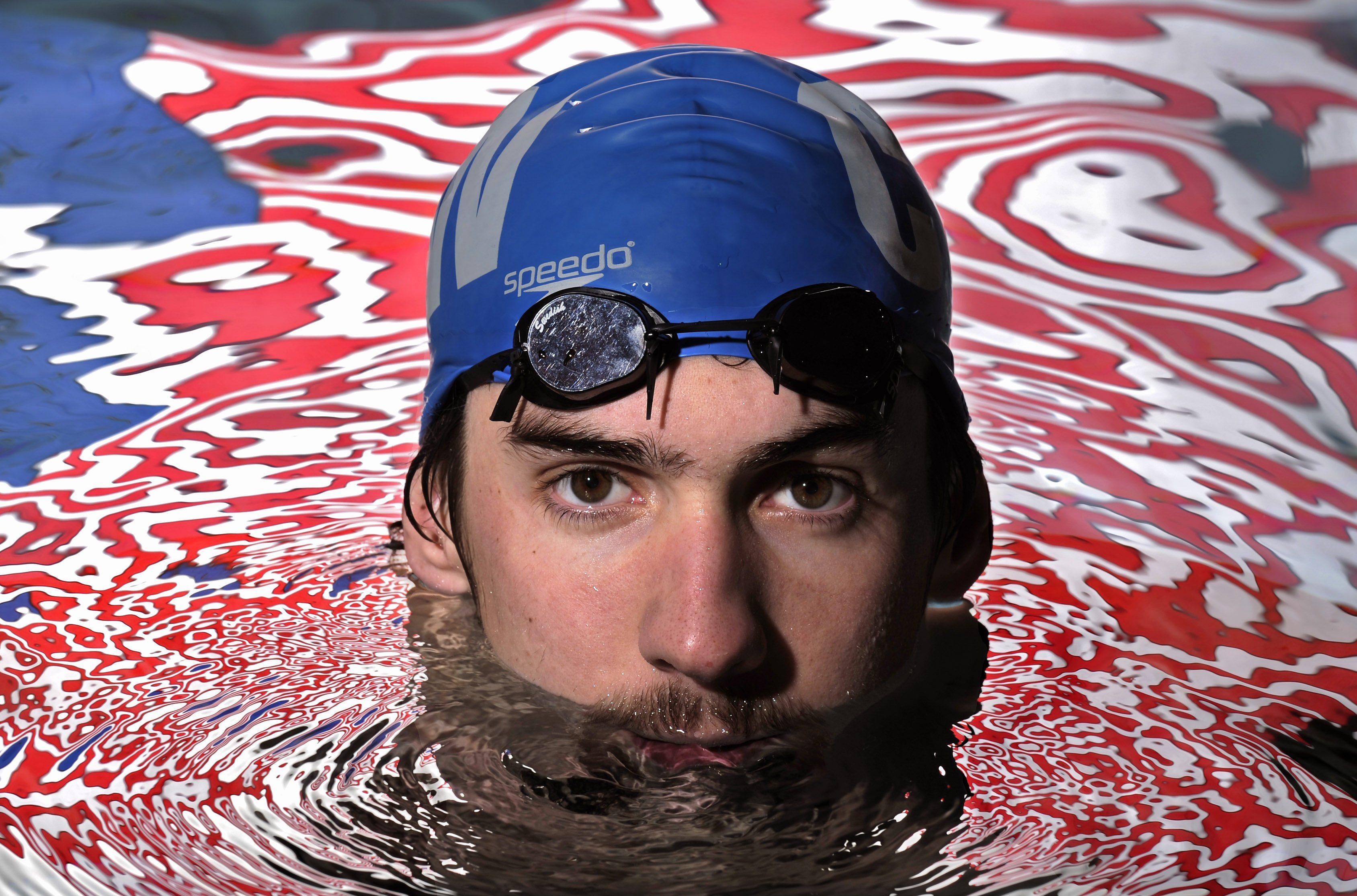 FILE - Olympic gold medalist Michael Phelps poses in the Belmont Plaza Olympic Pool in Long Beach, Calif., Jan. 18, 2008. Almost any Olympic athlete can tell you where the spark was lit to push them into sports. For many, it was in front of a TV set as a kid, watching the Summer Games play out in some faraway place — and often, Michael Phelps was the athlete that drew their interest. 
