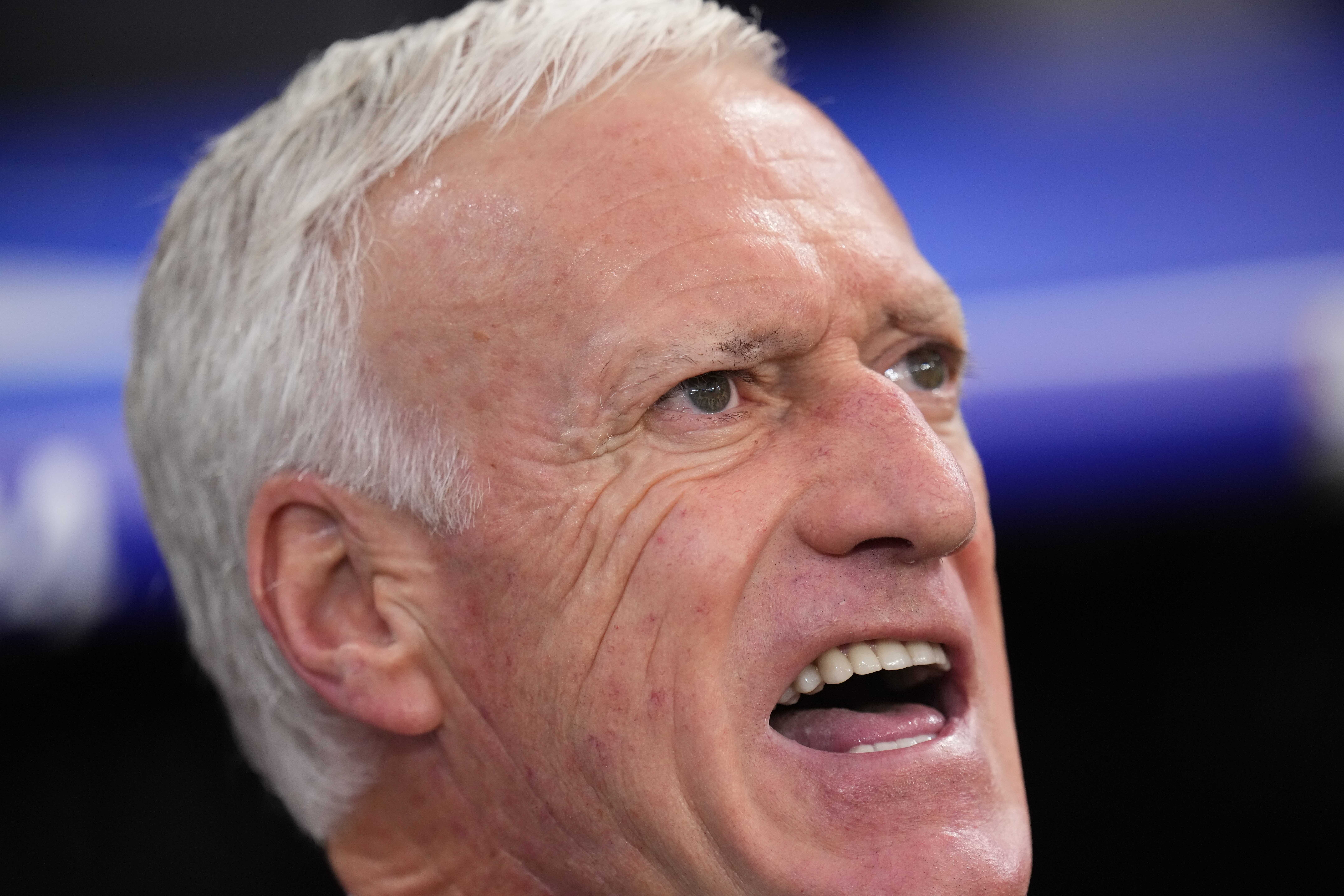 France head coach Didier Deschamps sings during the national anthem prior to the start of a semifinal match between Spain and France at the Euro 2024 soccer tournament in Munich, Germany, Tuesday, July 9, 2024. 