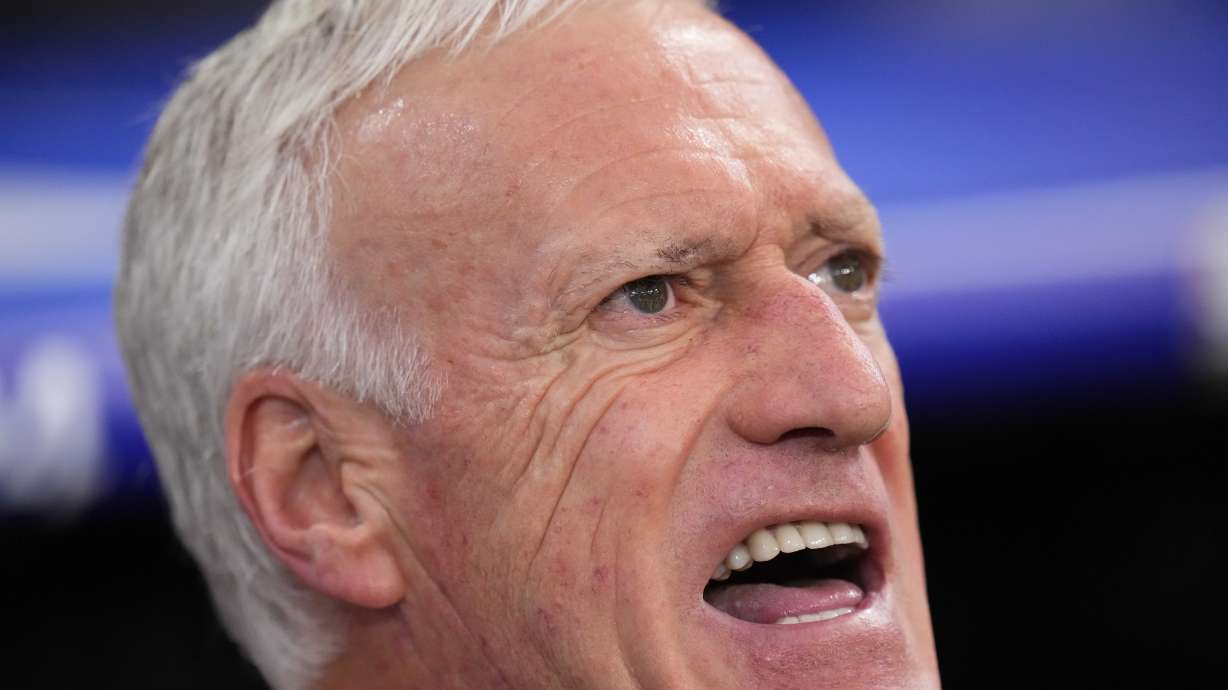 France head coach Didier Deschamps sings during the national anthem prior to the start of a semifinal match between Spain and France at the Euro 2024 soccer tournament in Munich, Germany, Tuesday, July 9, 2024.